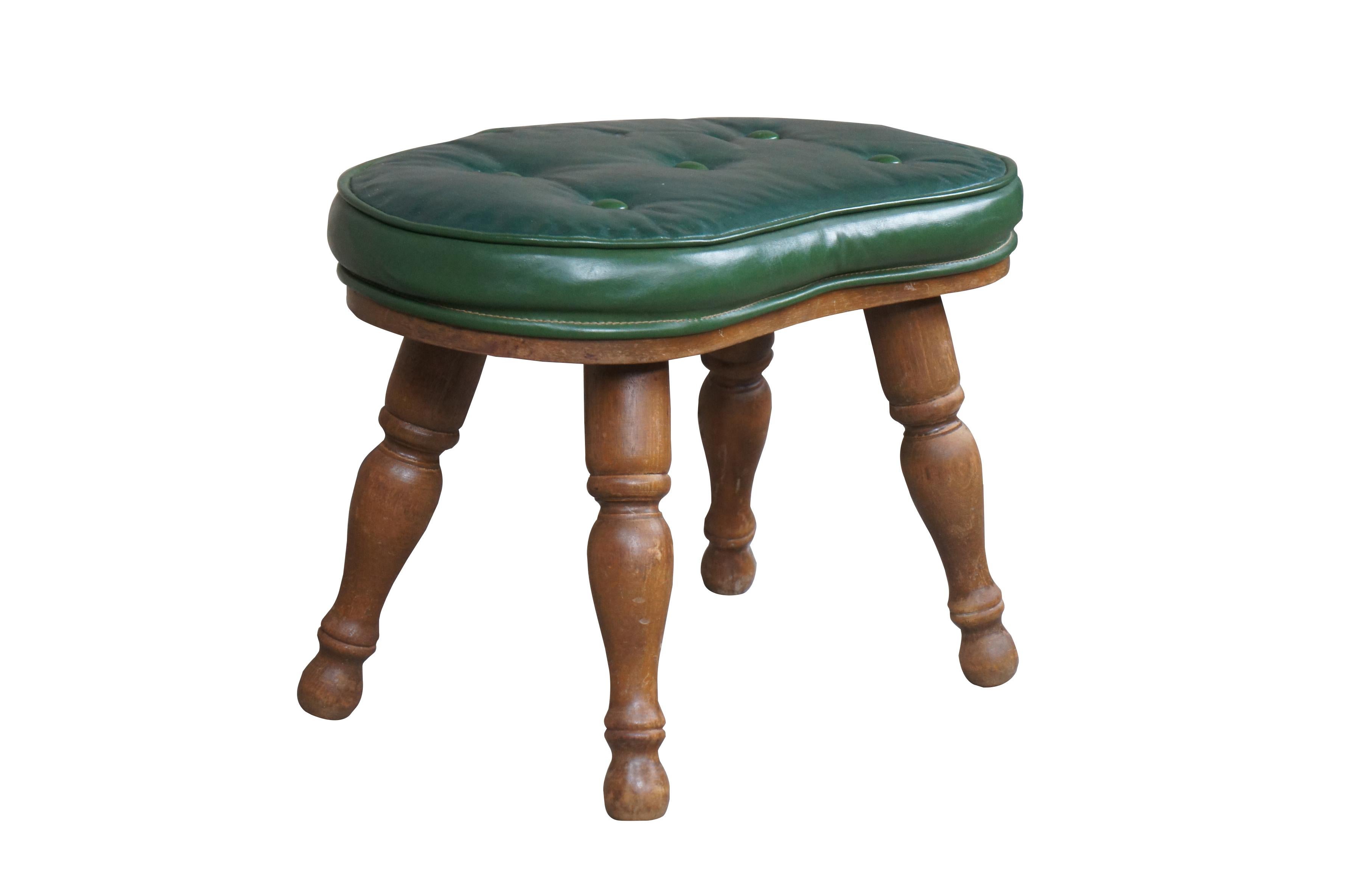 Midcentury Kidney Bean Foot Stool, Bench seat or Ottoman. Features a hardwood frame with turned legs and a green vinyl tufted seat. A retro design that will draw attention in any space.