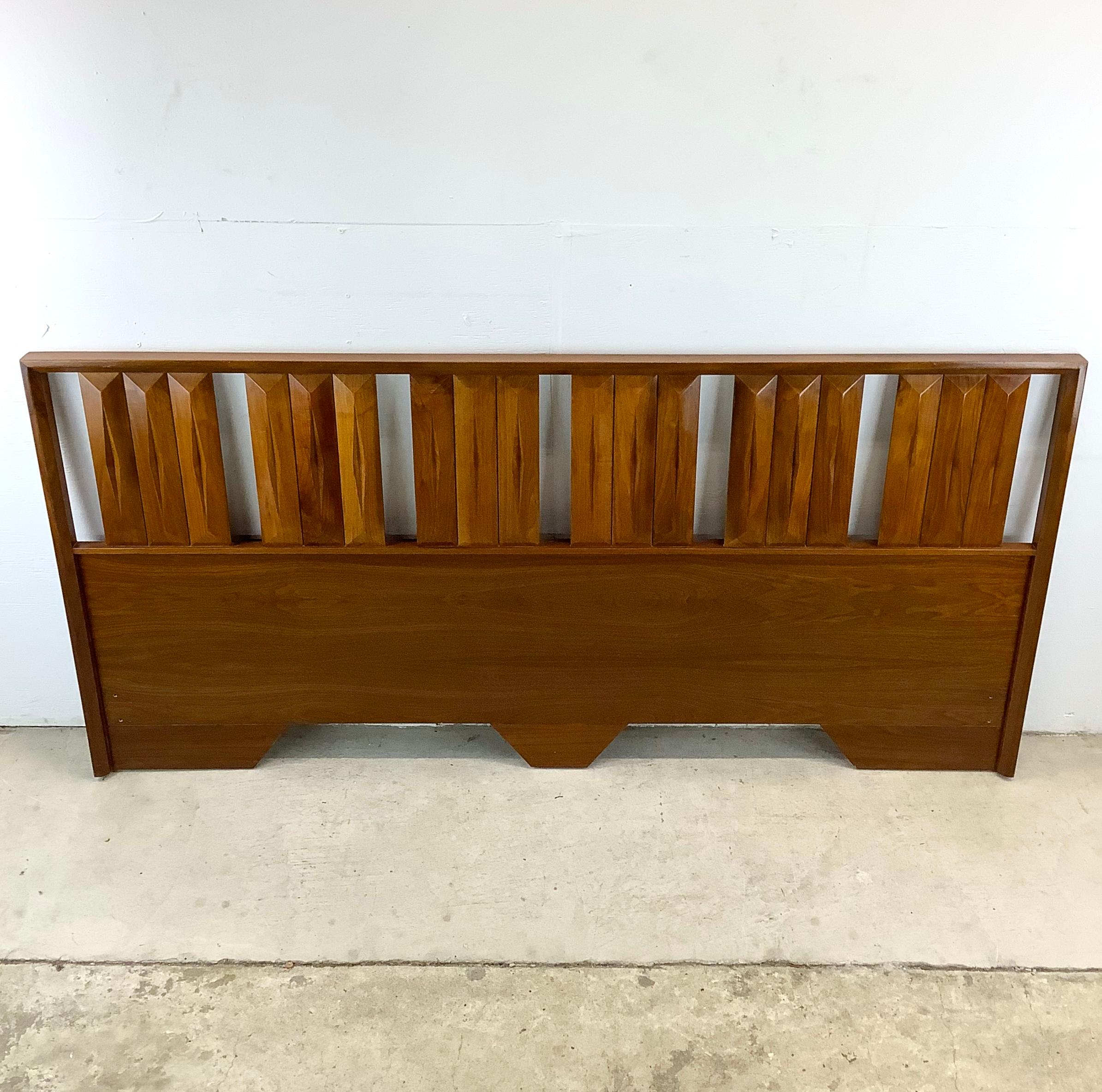 Transform your bedroom into a haven of mid-century elegance with this stunning king-sized walnut headboard, attributed to Albert Parvin for James Cameron circa 1960s. This piece is a true representation of mid-century modern design, featuring a