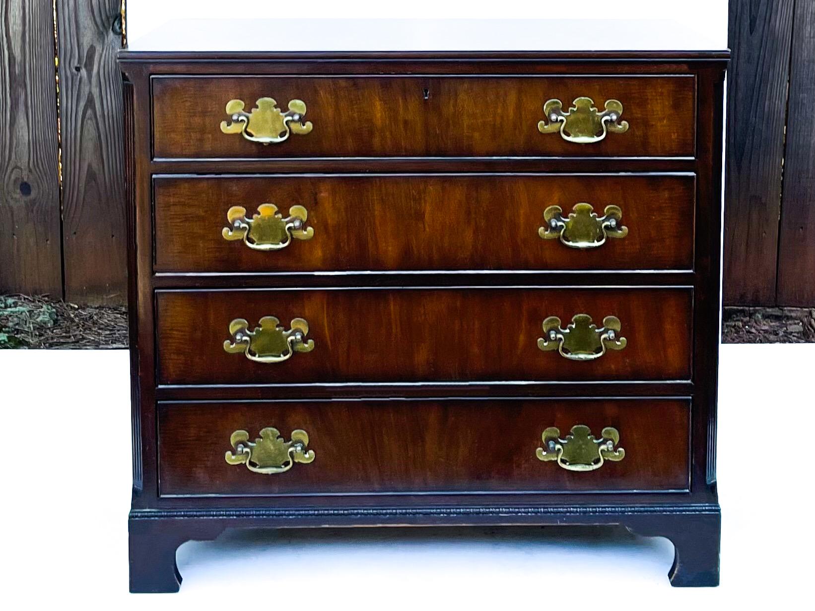 This is a classic pair of mahogany bachelor’s chests by Kittinger. They most likely date to the 50s/60s. Note the regal solid brass hardware and bracket feet. They also have dovetail construction.