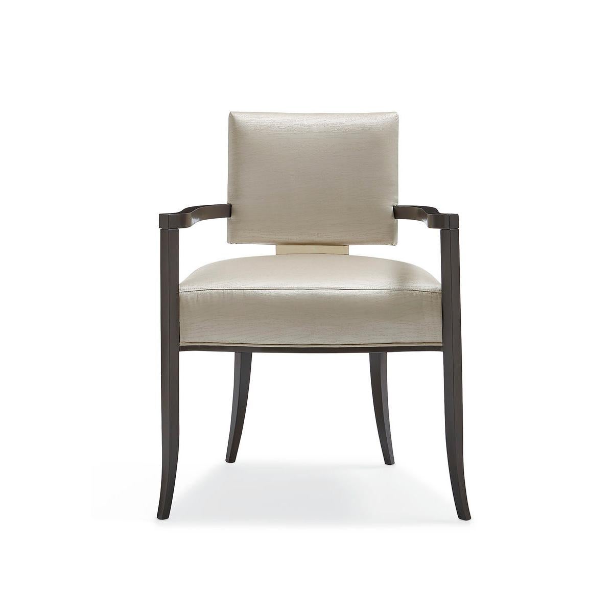 Modern Dining Armchair, for a fresh interpretation on a low, modern klismos chair, this silhouette takes on dramatic style when you view the wide, Whisper of Gold panel that shines off its back. A neutral sateen fabric with a subtle moire pattern