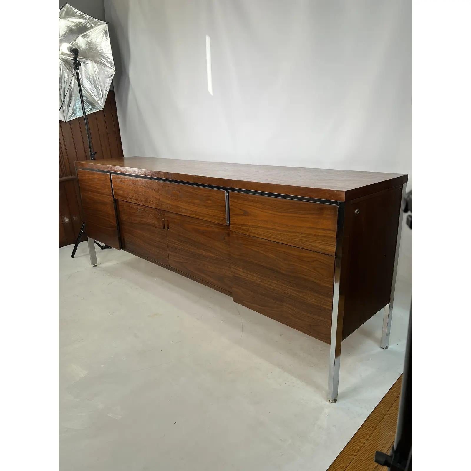This mid-century Knoll style walnut credenza is made by Jofco. The credenza was made with amazing craftsmanship. It is stylish and sleek and is perfect for your home or office.