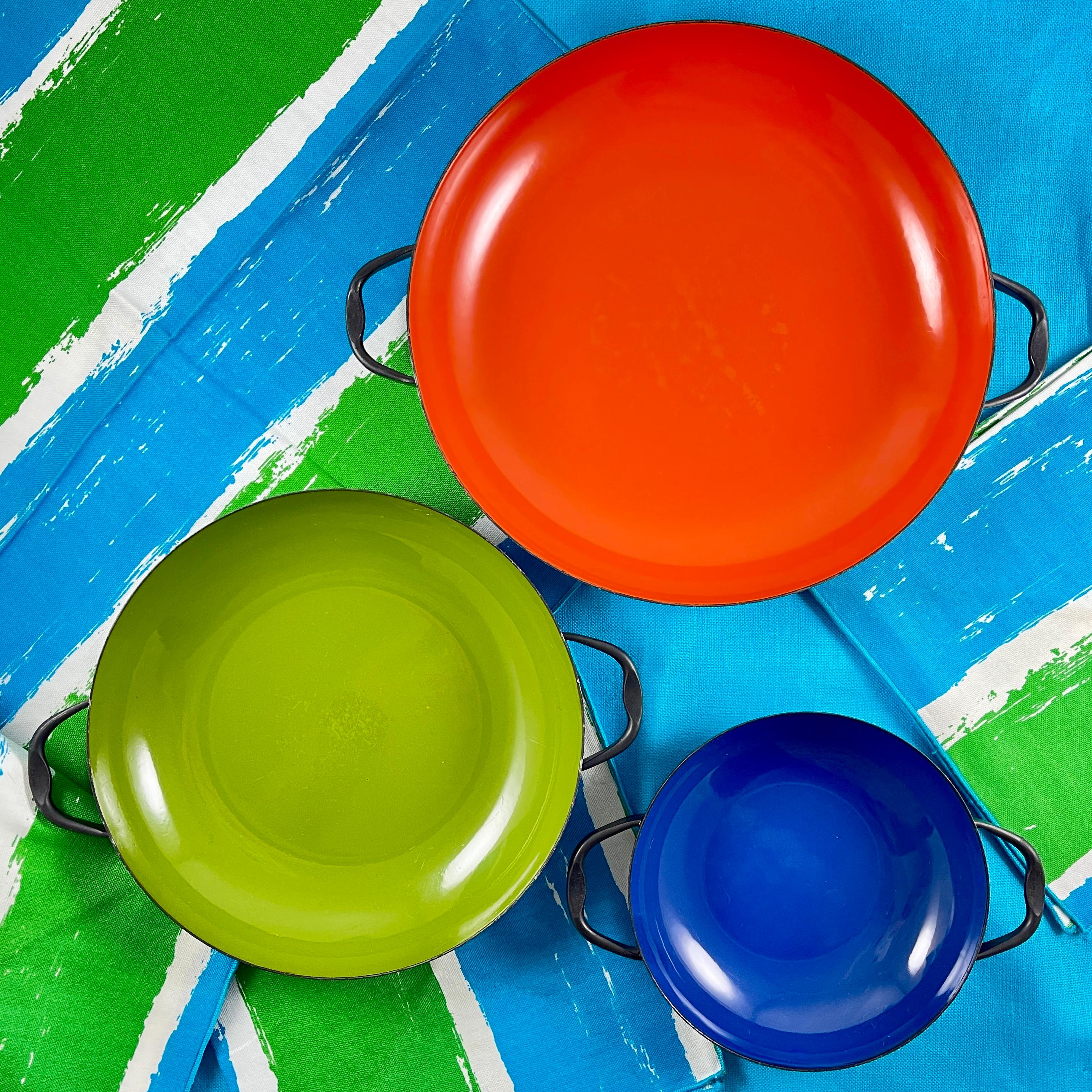 A set of three nesting Enamel on Steel handled baking and serving dishes designed by Herbert Krenchel for Krenit Denmark in 1953.

The Krenit set was produced from 1953 to 1966. Krenchel’s pieces are an excellent example of iconic, quality