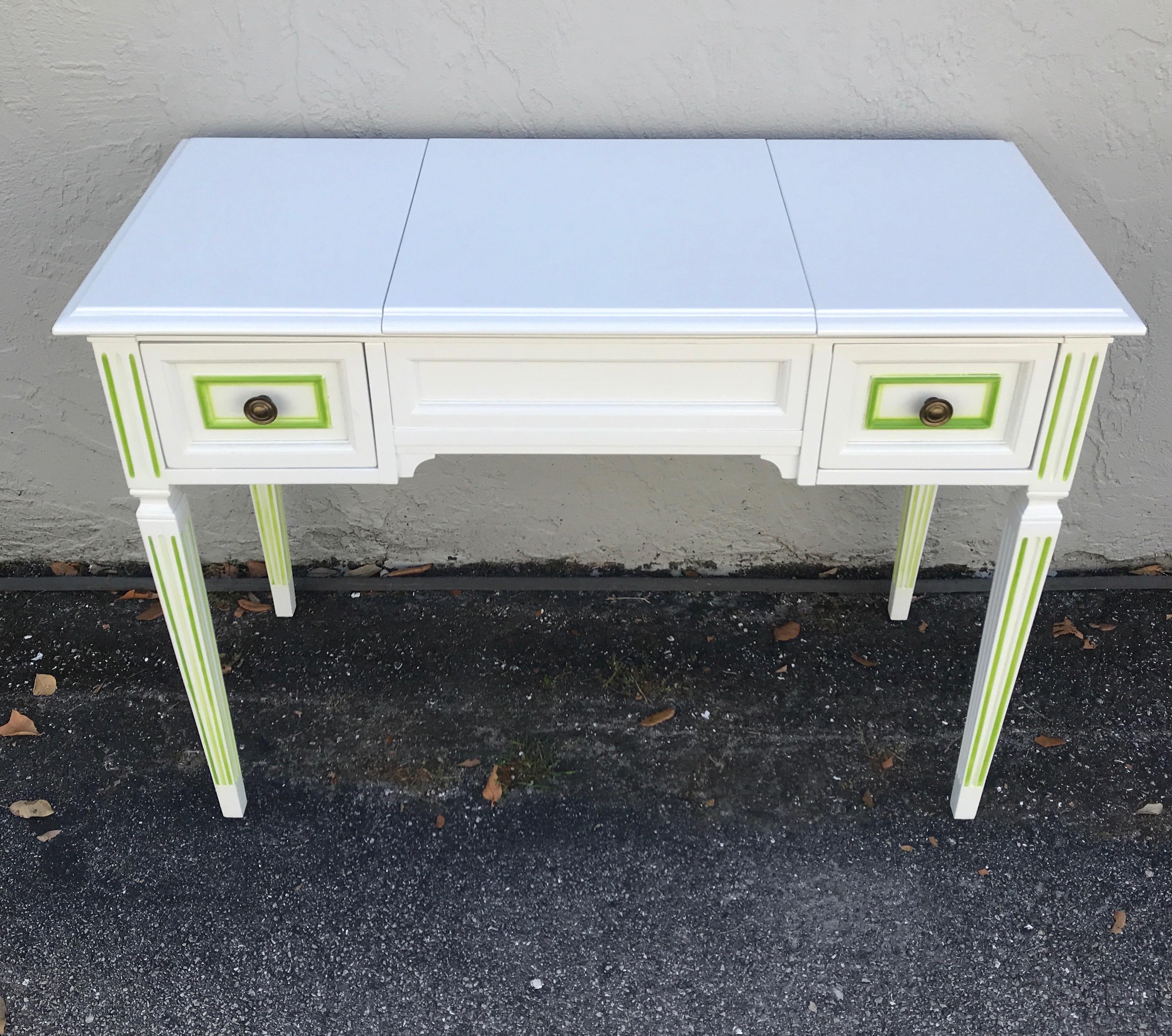 White lacquered mid century Louis XVI style dressing table outlined in lime green accent.