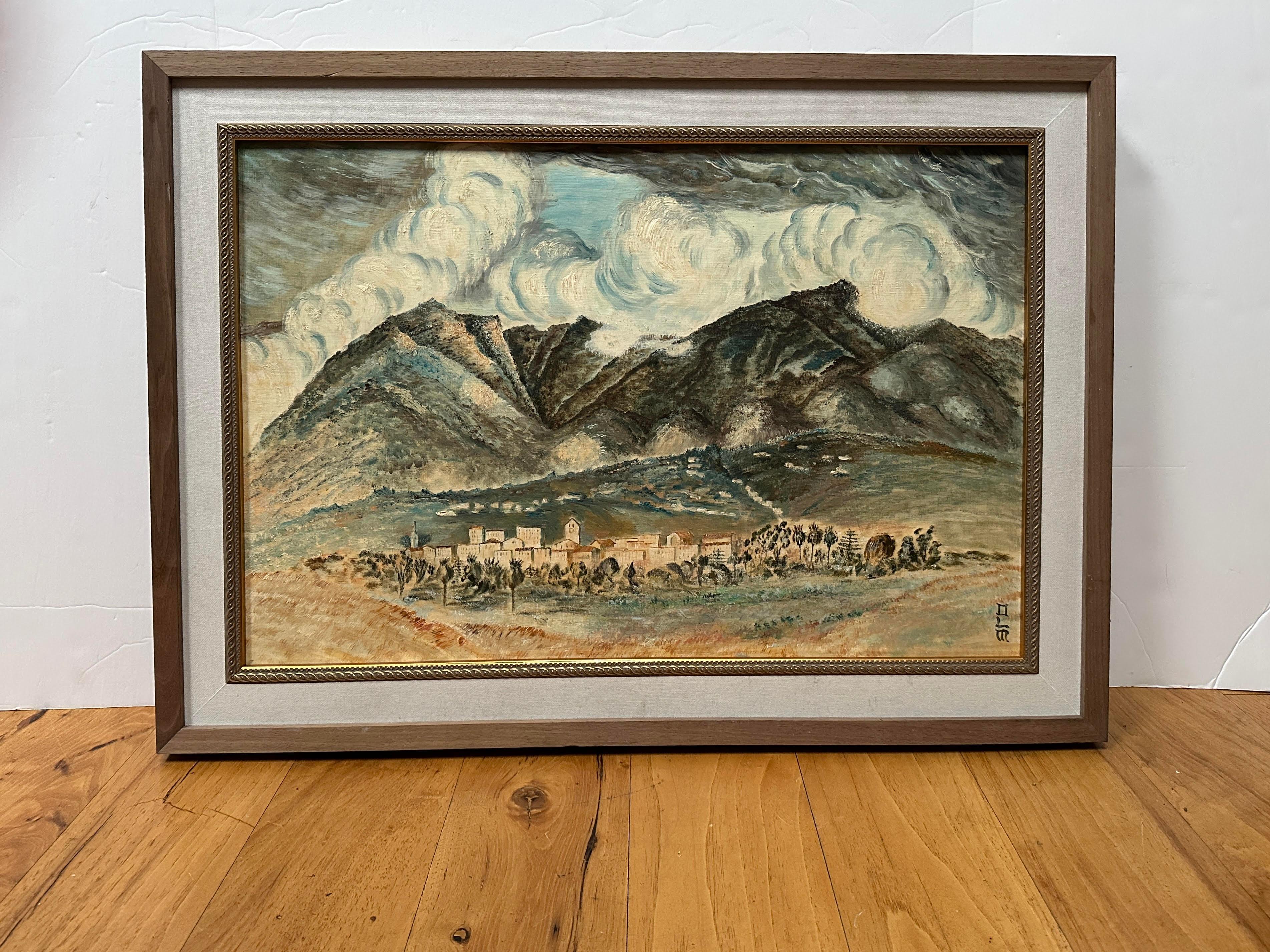 This Mid-Century oil painting depicts, mountains, voluminous clouds and a small village. The mountains and clouds have a foreboding energy about them and the Italian feeling village in a grove of trees feels small in comparison. The cool colors in