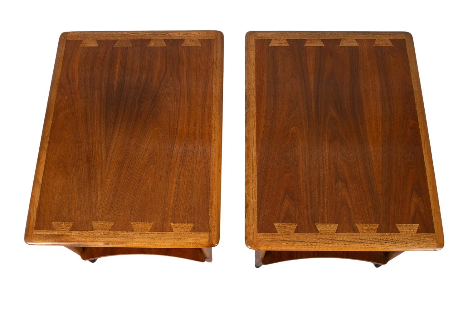 A beautiful pair of end tables by Lane Furniture Co. from the Lane ‘Acclaim’ collection, designed by Andre Bus. Remains in good condition throughout. Featuring stunning, signature dovetailed design, in a vivid contrast against the surface with
