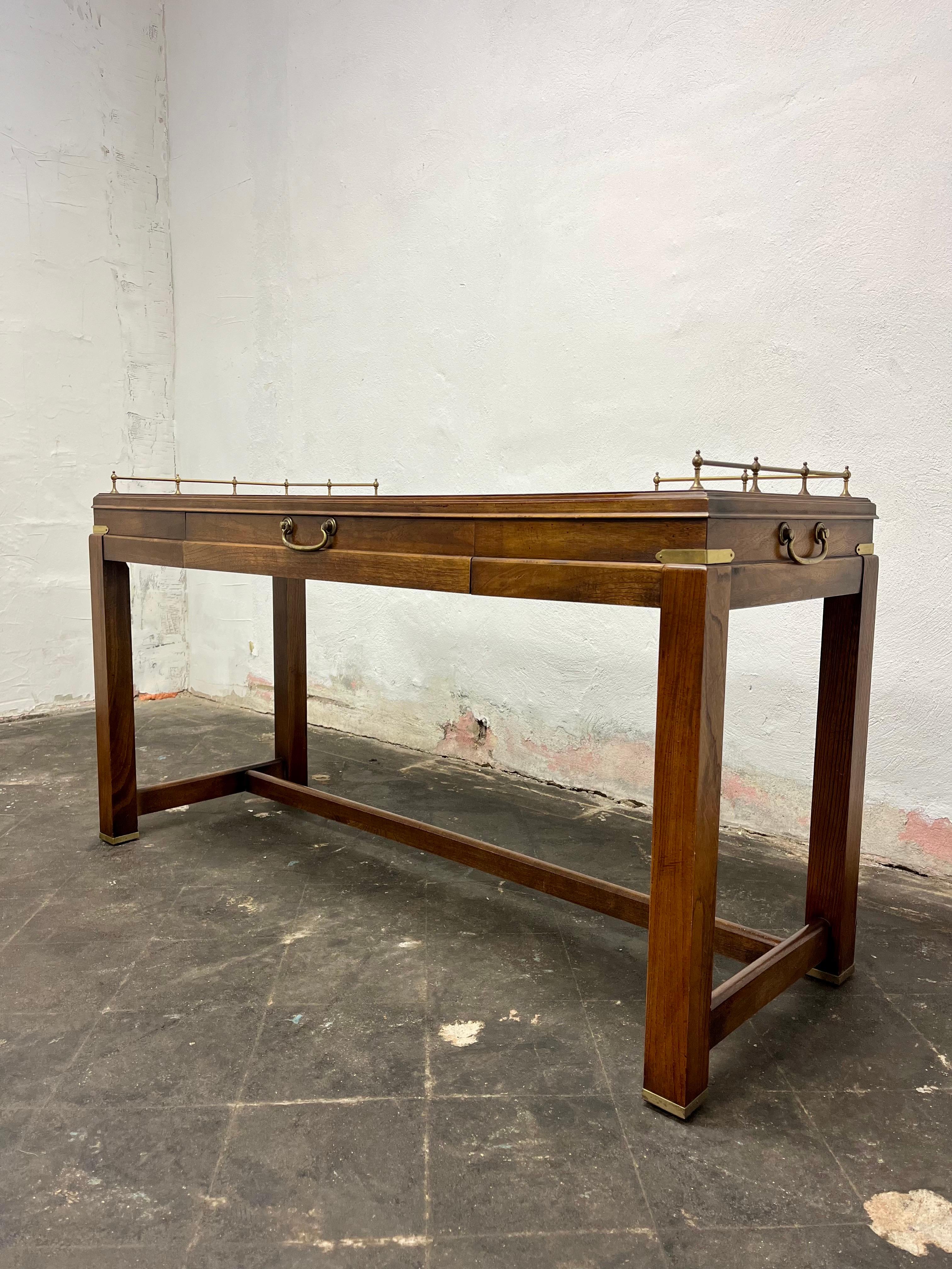 Lane Mid-Century Modern burl walnut serving or console table with brass gallery back
A truly stunning piece made by a great designer. The burled walnut has a stunning patina, the brass gallery to the back adds a sense of Regency glamour to the