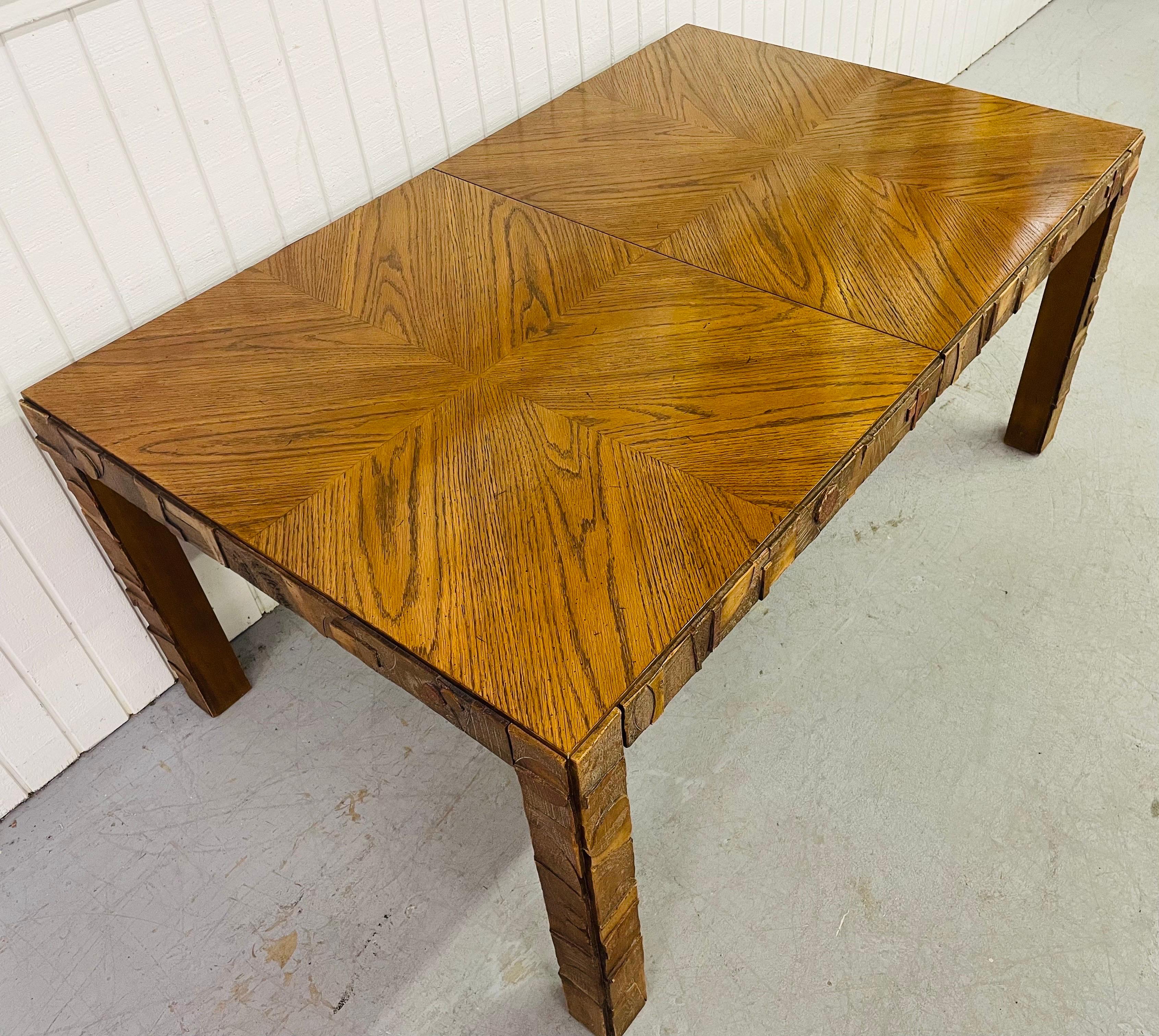 This listing is for a mid-century Lane Pueblo walnut dining table in the style of designer Paul Evans. Featuring an oak rectangular top, walnut finish, and Paul Evans style brutalist designs on the legs.

Extends up to 82.75” L with table leaf.