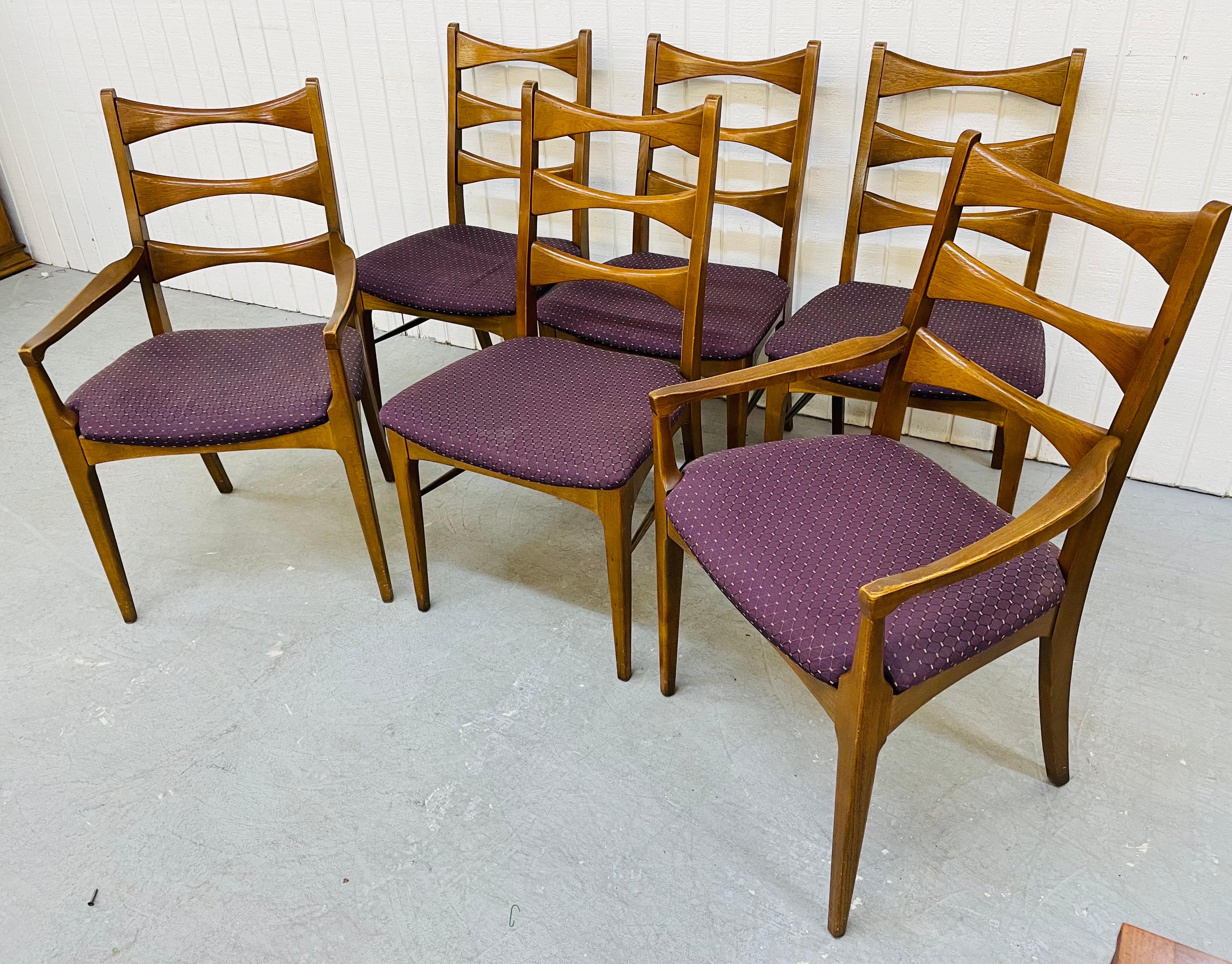 This listing is for a set of six mid-century Lane rhythm walnut dining chairs. Featuring four straights, two arm chairs, ladder style back rest, purple upholstered cushions, and a beautiful walnut finish.