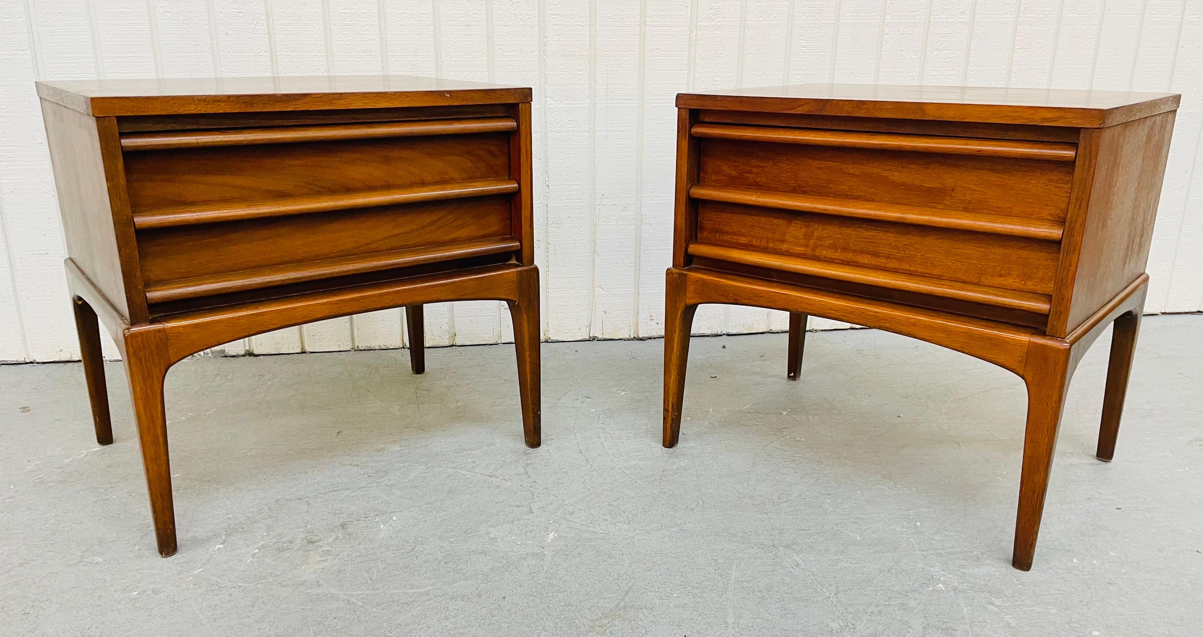 This listing is for a pair of mid-century Lane Rhythm walnut nightstands. Featuring a single drawer for storage, tall legs, and a beautiful walnut finish.