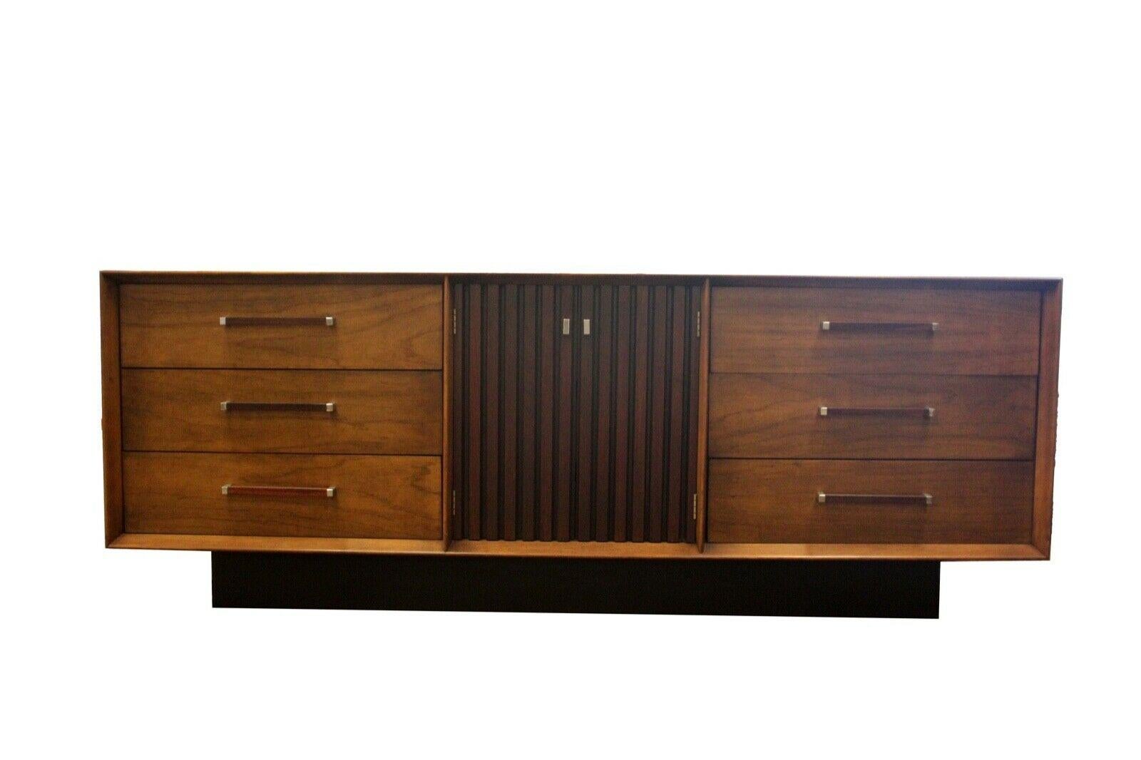 From Le Shoppe Too in Michigan comes this wonderful vintage modern bedroom set which includes a matching lowboy dresser, large storage tallboy or armoire, and a pair of nightstands. Known as the Lane 'Tower' Suite, this unique two-tone design with