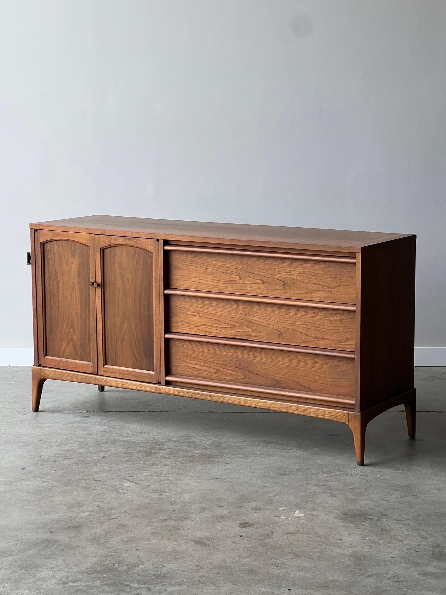 Mid Century Lane walnut credenza with three smooth operating hefty drawers and reversible cane or walnut front cabinet doors (optional) as you get to pick which you’re feeling anytime! Single serving interior drawer and plenty of space for records