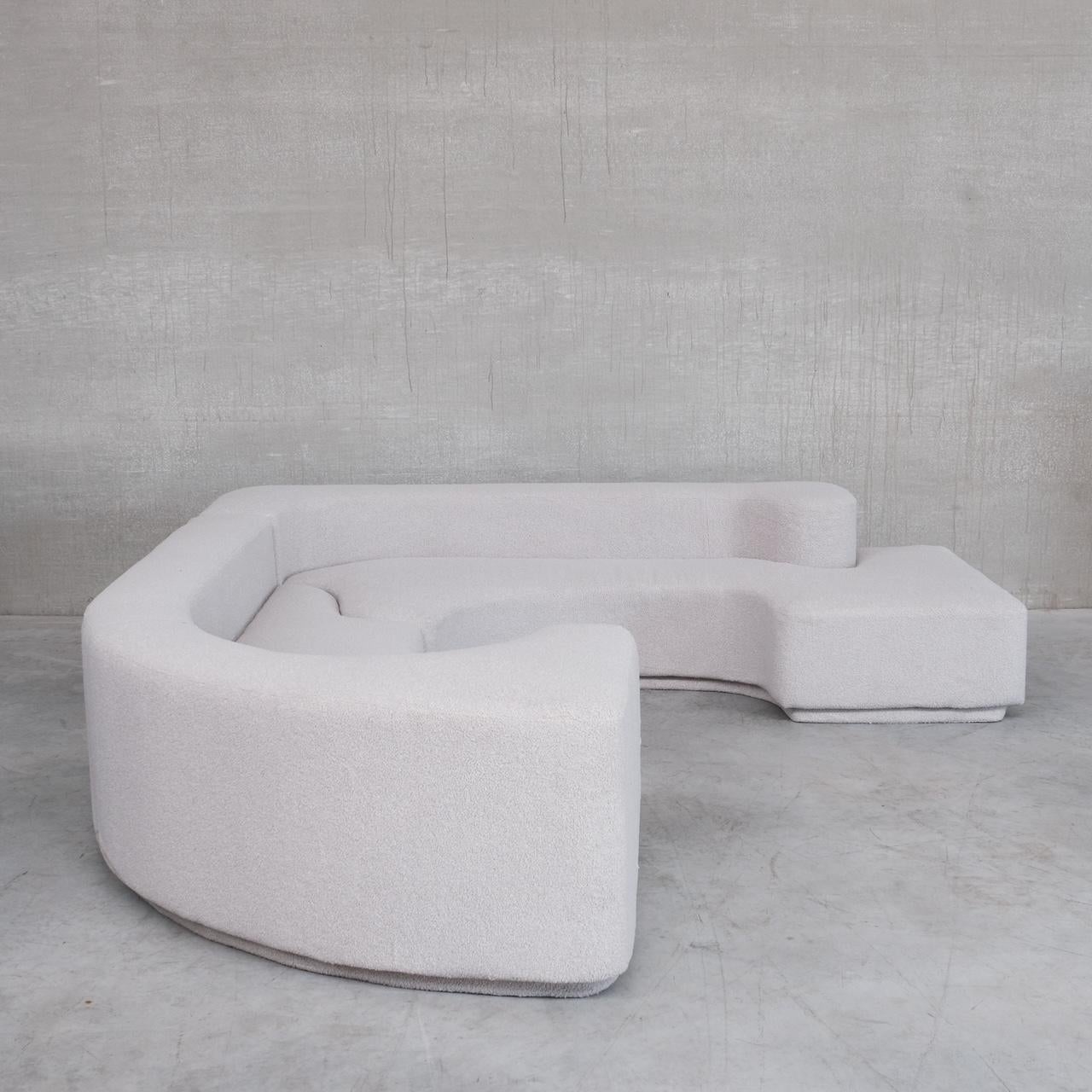 A mid-20th sectional 'Lara' sofa by Roberto Pamio & Renato Toso for Stilwood.

Italy, c1958. 

Professionally re-upholstered in premium grey boucle fabric. 

Formed from two pieces, in a puzzle like connection. Good looking from every angle.