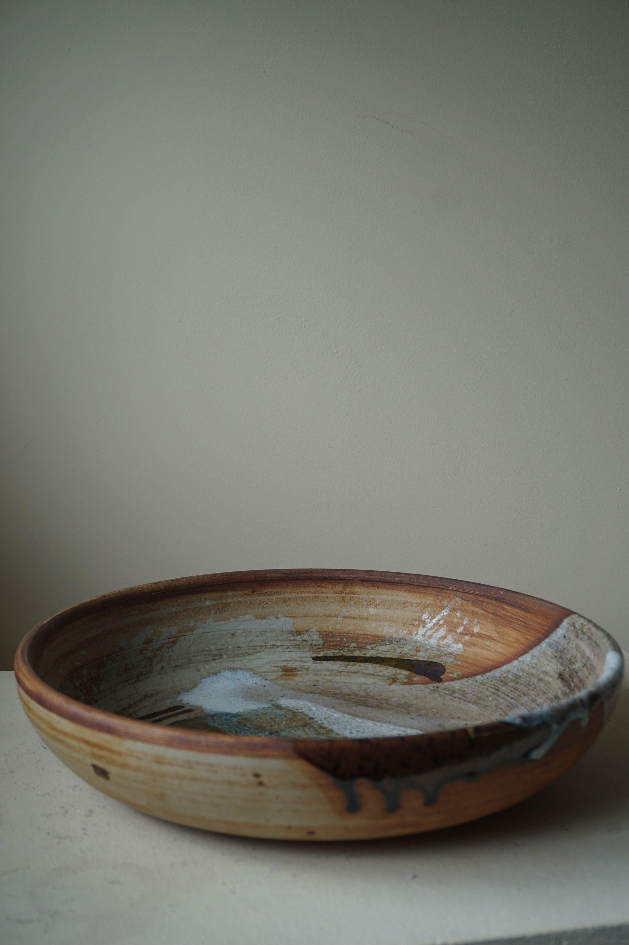 Beautiful large stoneware bowl by Danish artist Conny Walther. Made in 1970s.
Great colour plate in this glaze.

Other mentionable ceramic artists from Denmark: Arne Bang, Axel Salto & Gertrud Vasegaard.