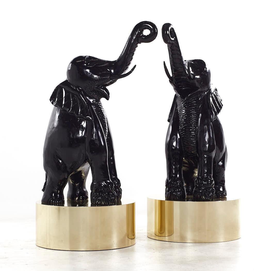 Mid Century Large Brass Base Elephant Sculptures - Pair

This sculpture measures: 24 wide x 26 deep x 53 inches high

We take our photos in a controlled lighting studio to show as much detail as possible. We do not photoshop out blemishes. 

We keep