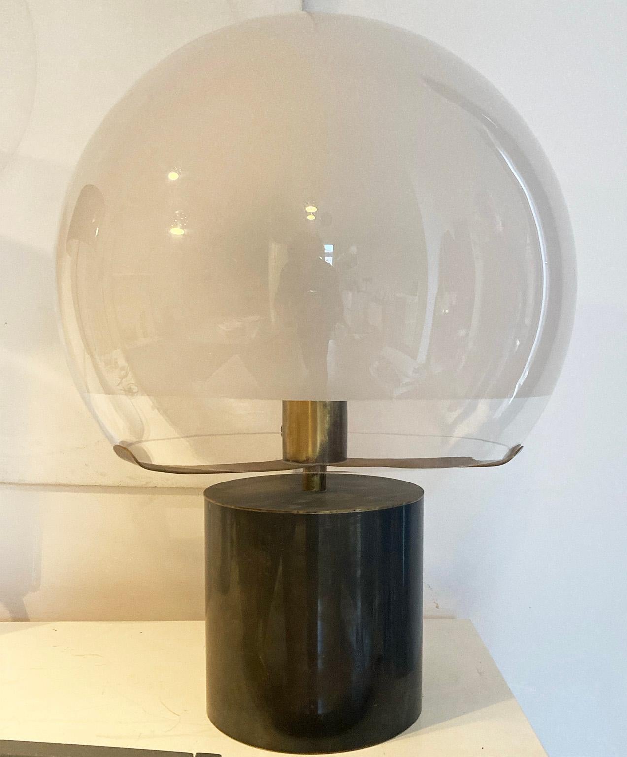 Monumental rare and fine brass table lamp designed in 1966 by the architect Luigi Caccia Dominioni for Azucena Manufacture; modello LTA6 “Porcino”
The brass structure thanks to three brass tongues holds the large and beautiful glass reflector. ( 45