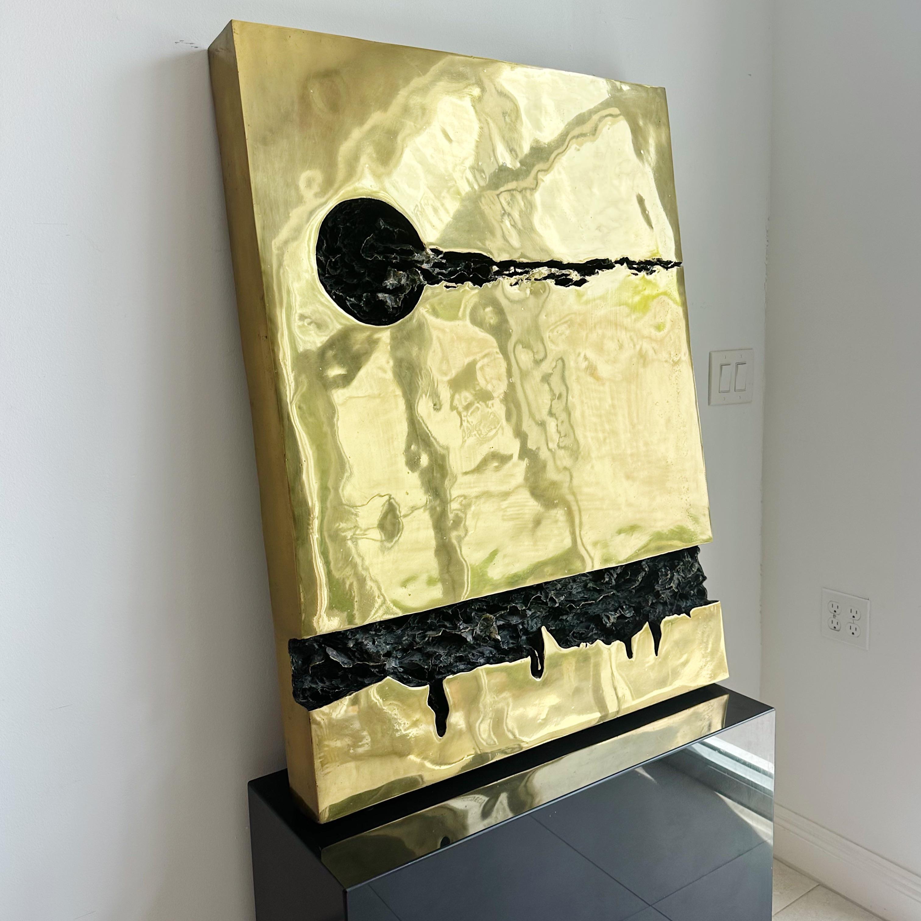 Mid Century Large Bronze Brutalist Sculpture
From the late 1970s, this brutalist sculpture is made of dark and gold bronze. Its fractured design stands out, and the piece offers versatility for wall mounting or plinth placement. Notably heavy, it's