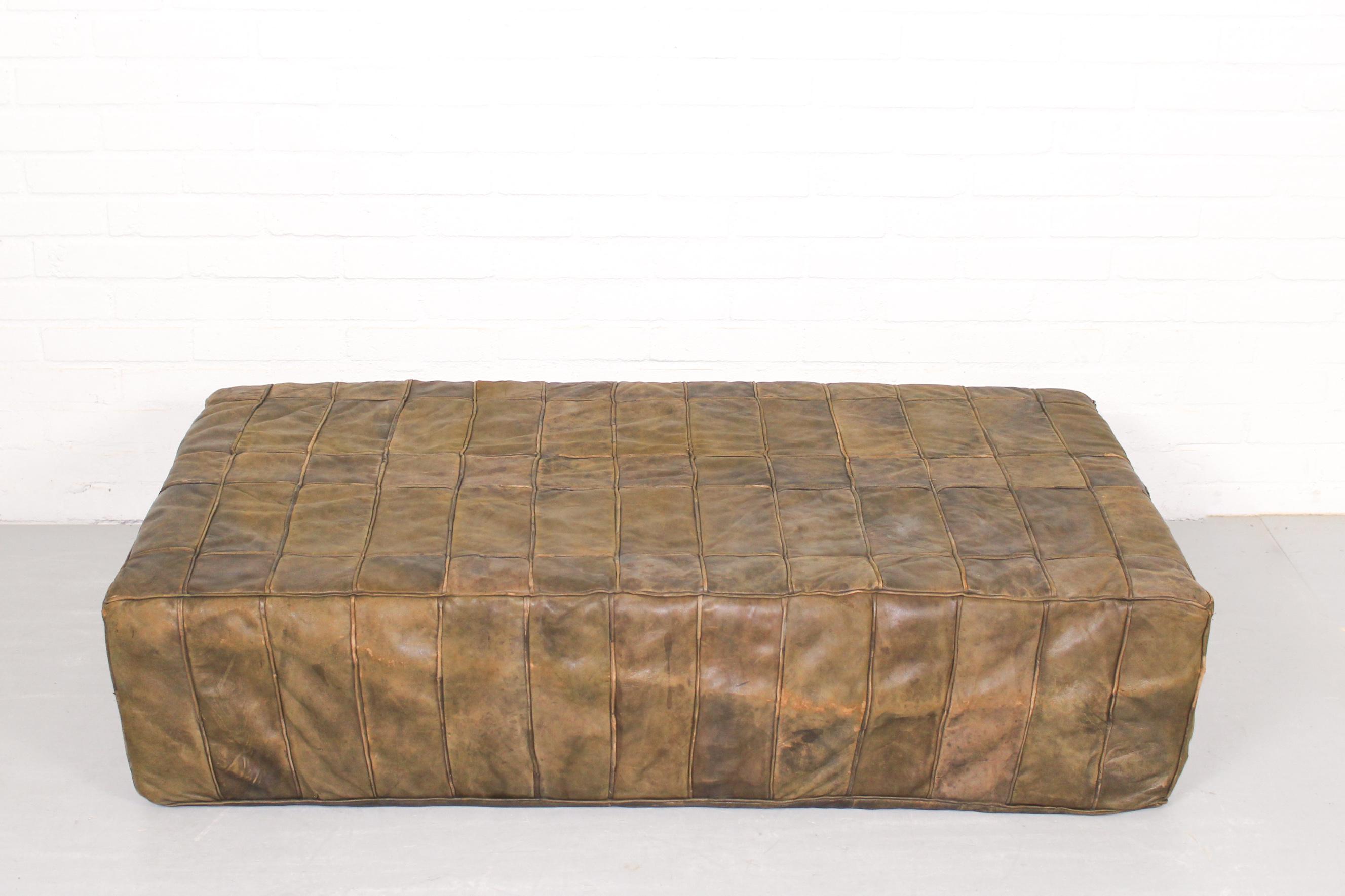 Superb large brown rectangular leather patchwork foot stool. New foam. A truly stunning piece of furniture with patina in accordance with age and use. 

Dimensions: 122cm w, 66cm d and 28cm h.
 