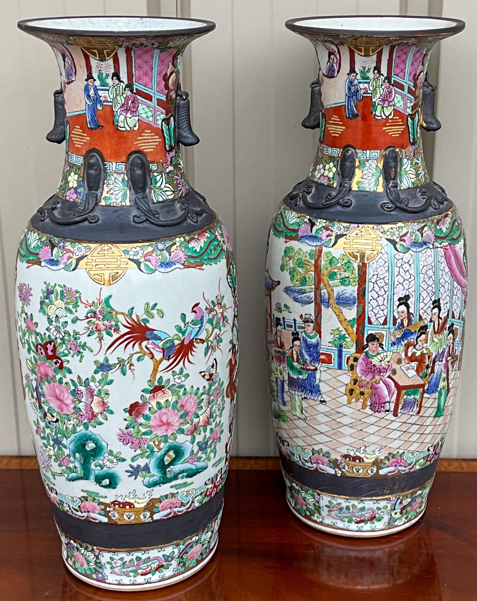 These are lovely Chinese Export style large scale vases. They are in very good condition and are marked on the underside. Note the vibrant colors and pastoral scenes!