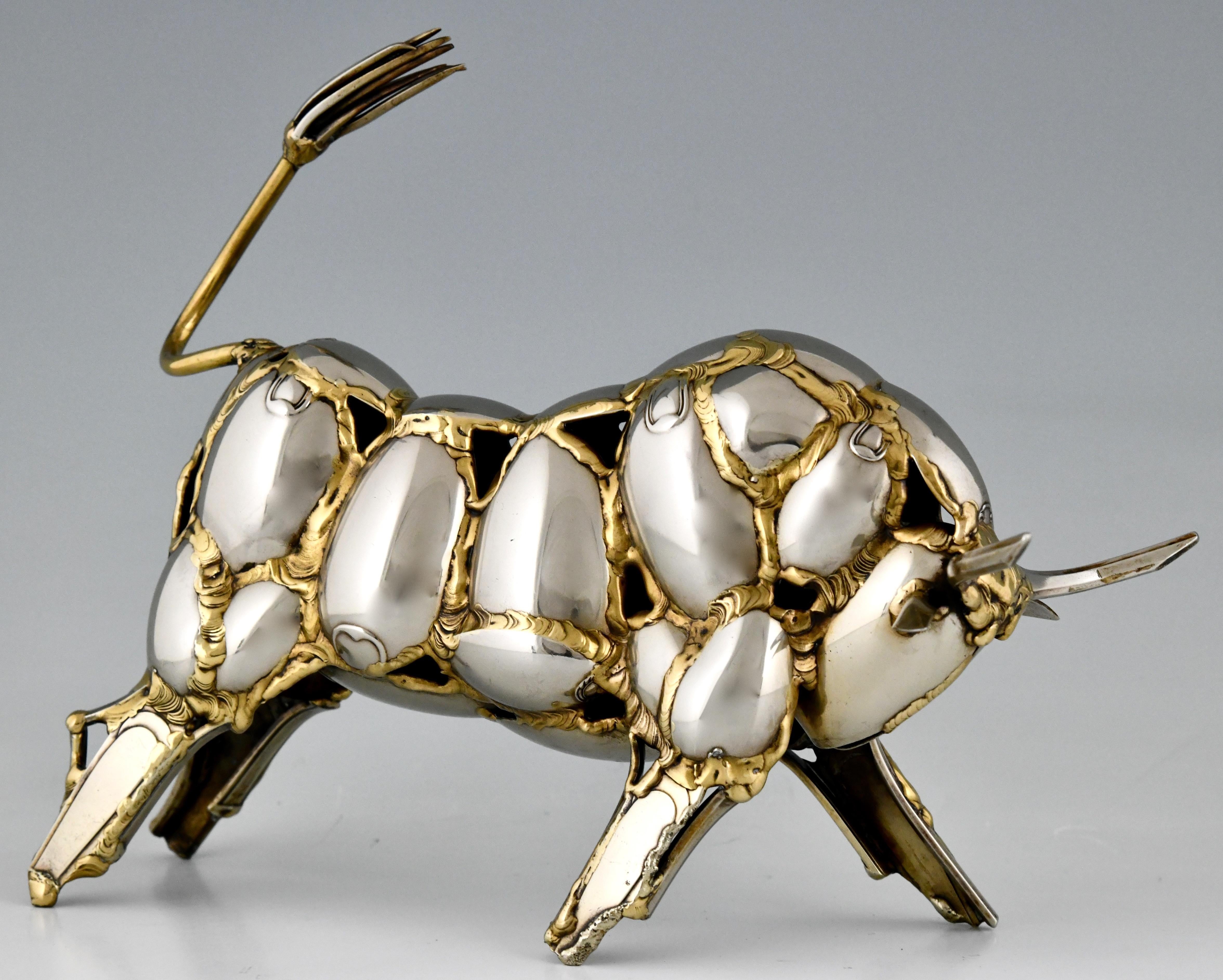 One of a kind Mid-Century Modern cutlery sculpture of a bull made of antique flatware, spoons, forks and knifes by the French Artist Gerard Bouvier, signed and dated 1985. 

 “Dictionnaire illustré des sculpteurs animaliers & fondeurs de
