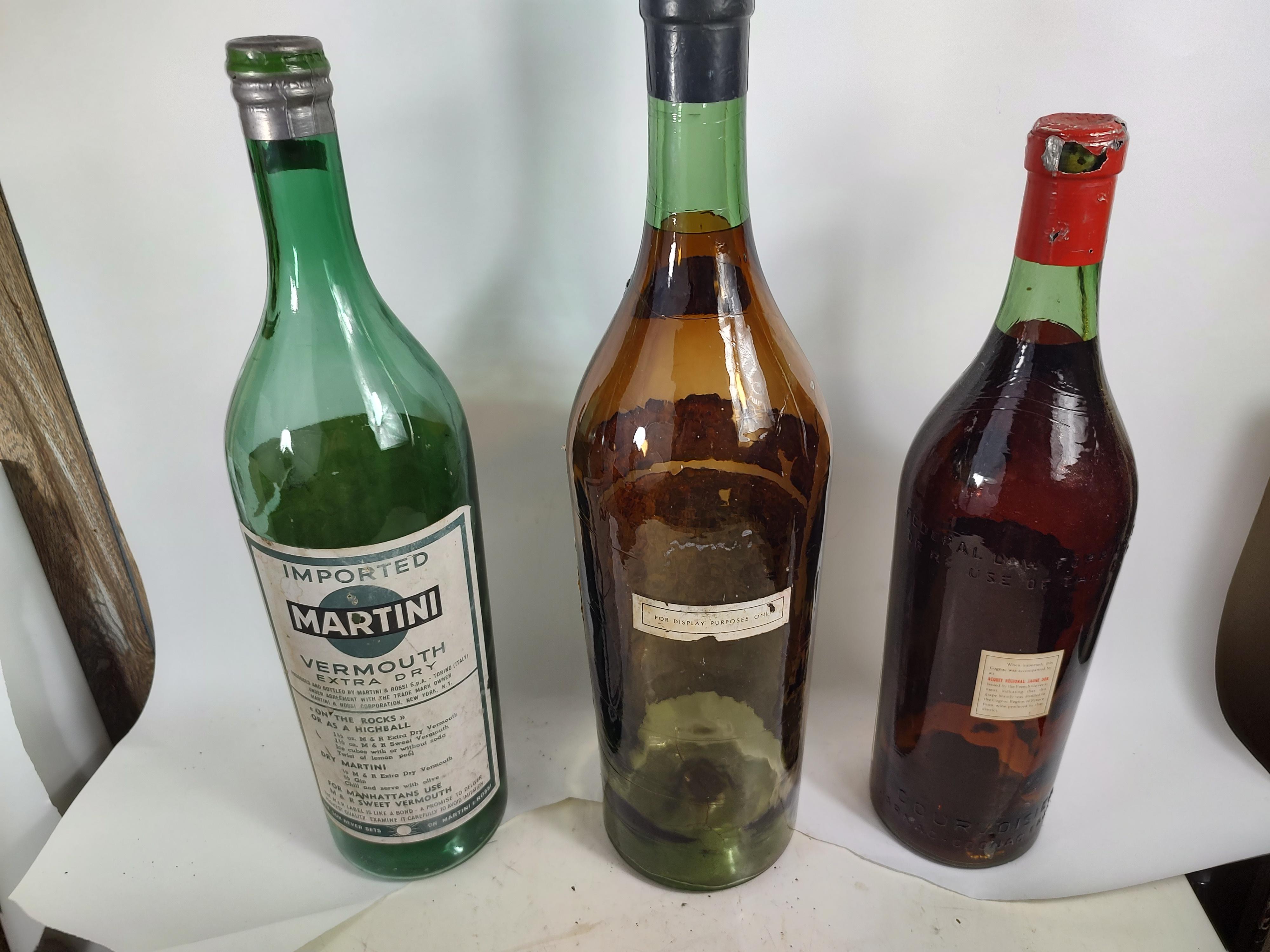 Fabulous display bottles hand blown with painted interior that imitates a full bottle of booze. In very good condition with minimal wear. Can be parcel posted.
