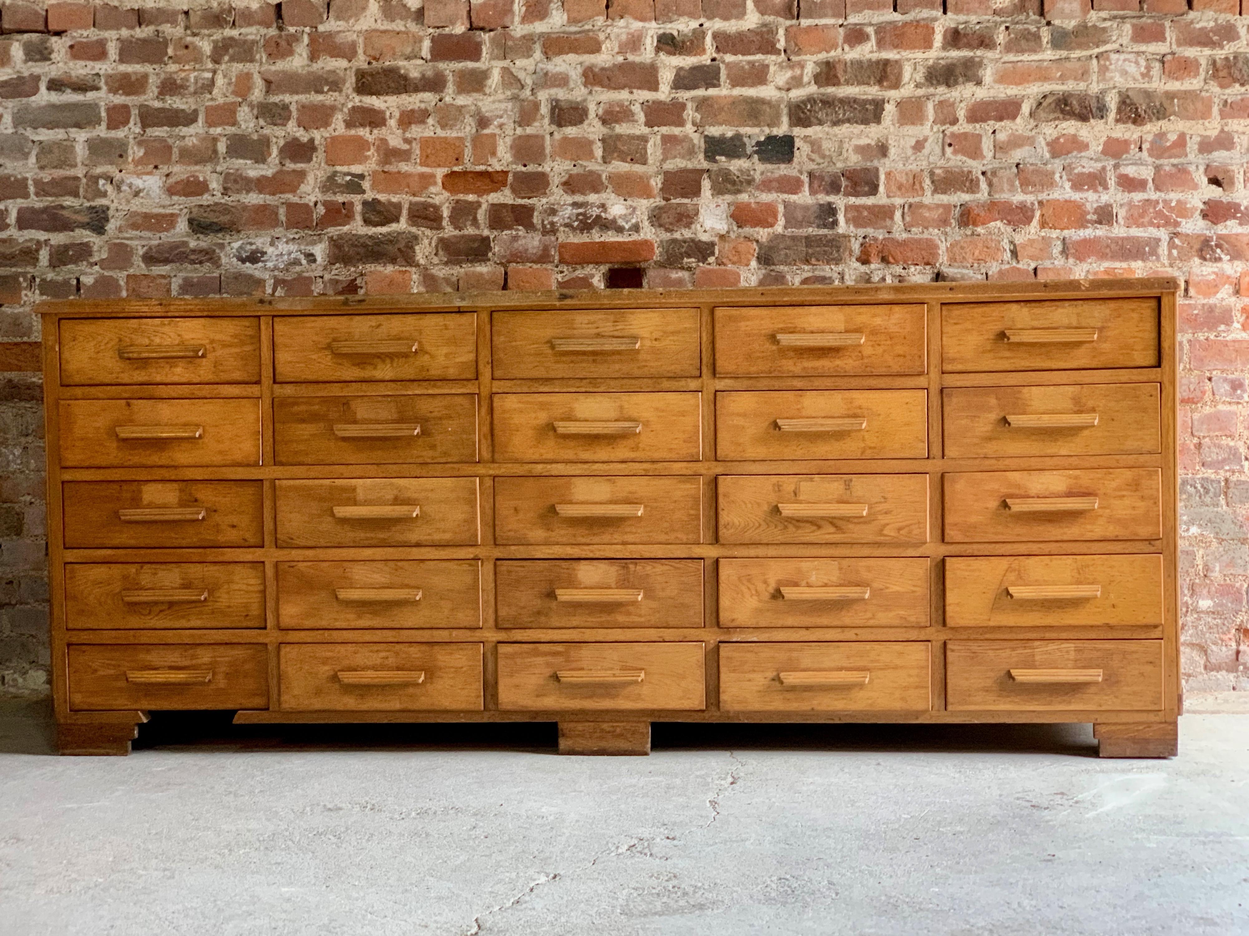 Midcentury large haberdashery oak shop counter 25 drawers 1940s.

A fabulous early 20th century extremely large Haberdashery oak shop counter/sideboard, the rectangular top over 25 well-proportioned and uniformed pull out drawers.

Ideal for the