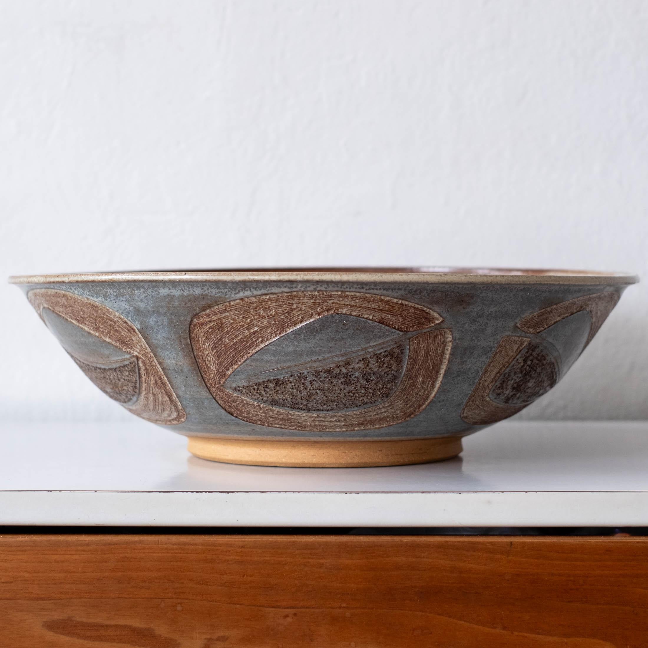 Large mid century ceramic bowl with a repeated incised design. Has what appears to be a Japanese signature. 1960s
