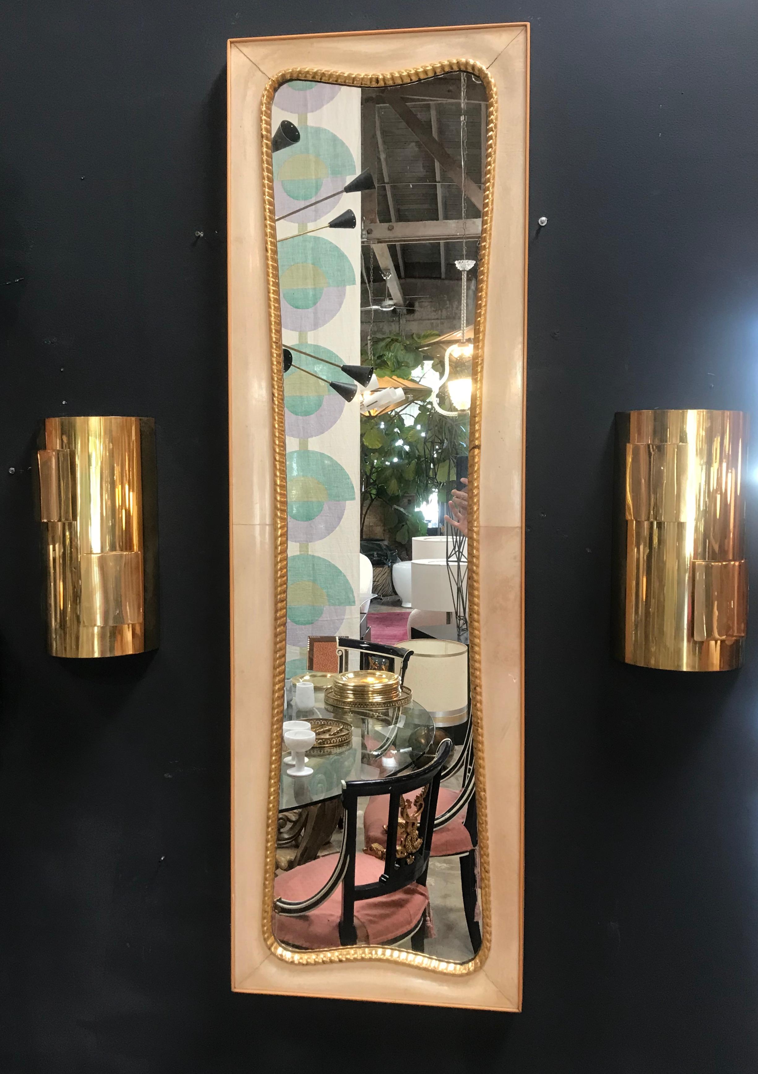 A stunning large Italian shield mirror with brass surround rectangular frame with the original 