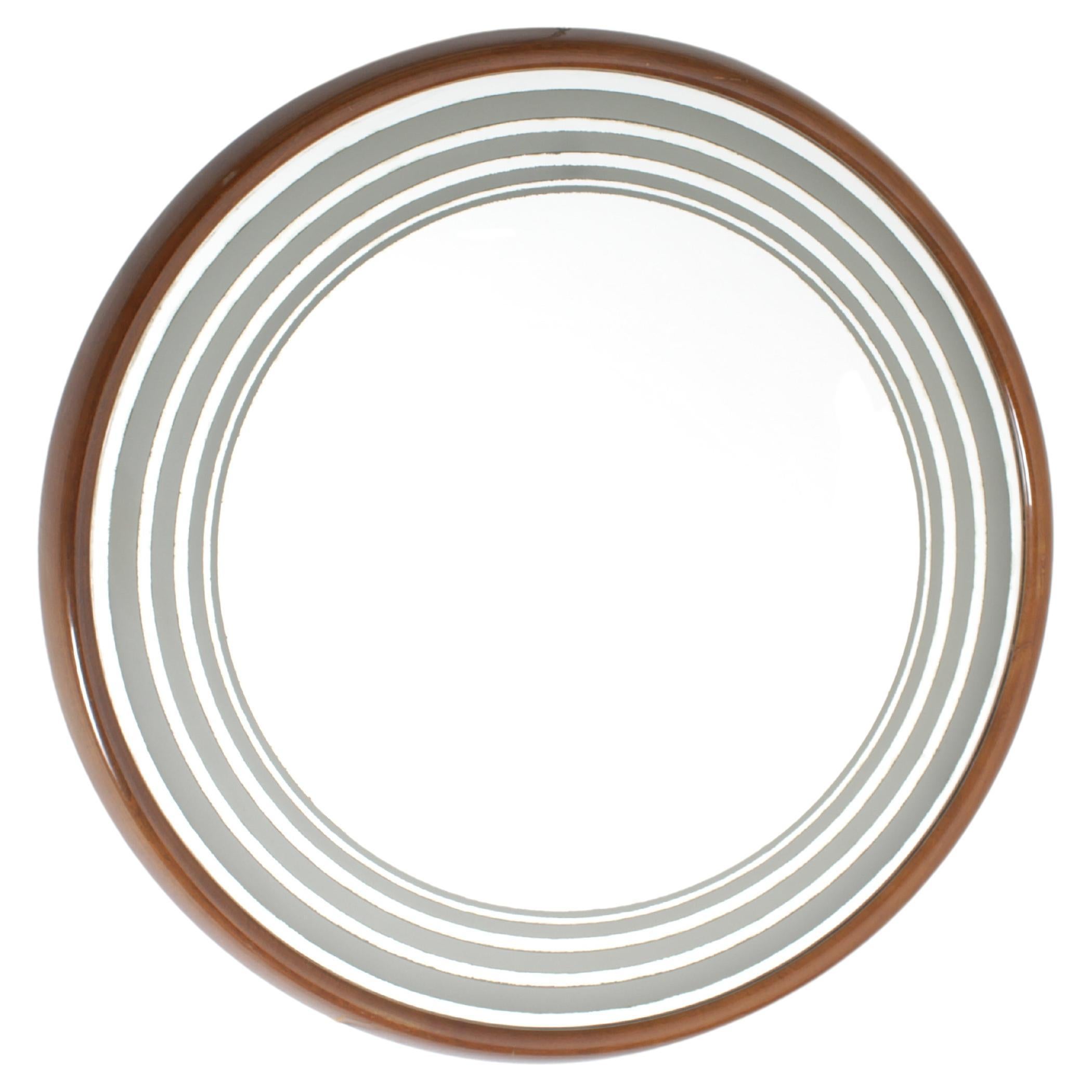 Large and beautiful round wall mirror with beveled wooden frame, backlit with a neon tube.
On the outer edge of the mirror there are five transparent rings through which the light diffuses. Valuable Italian production from the 1960s
Wear consistent