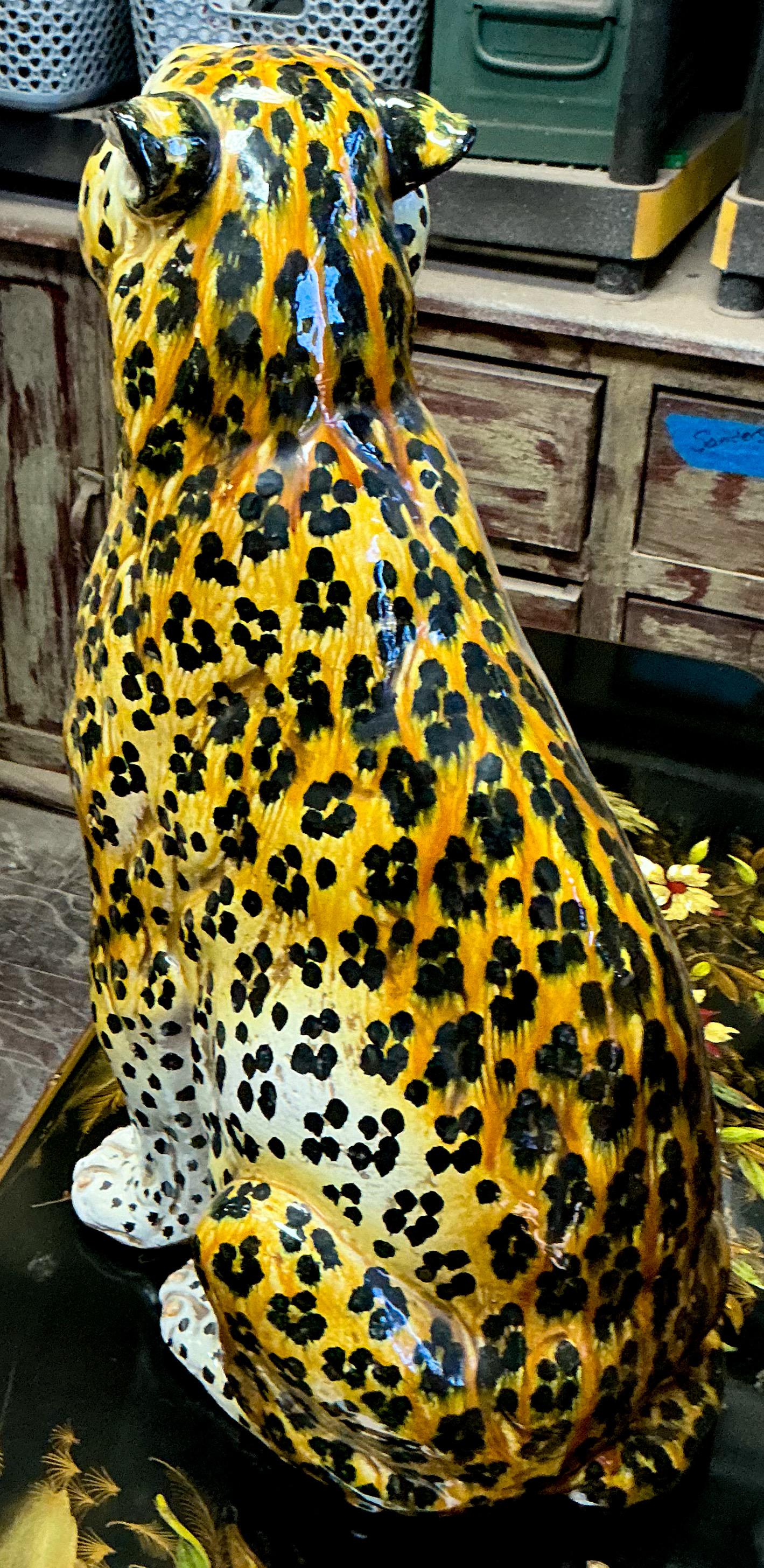 This is a large scale Hollywood Regency Italian terracotta seated leopard figurine. He dates to the 1960s and is in very good condition. 