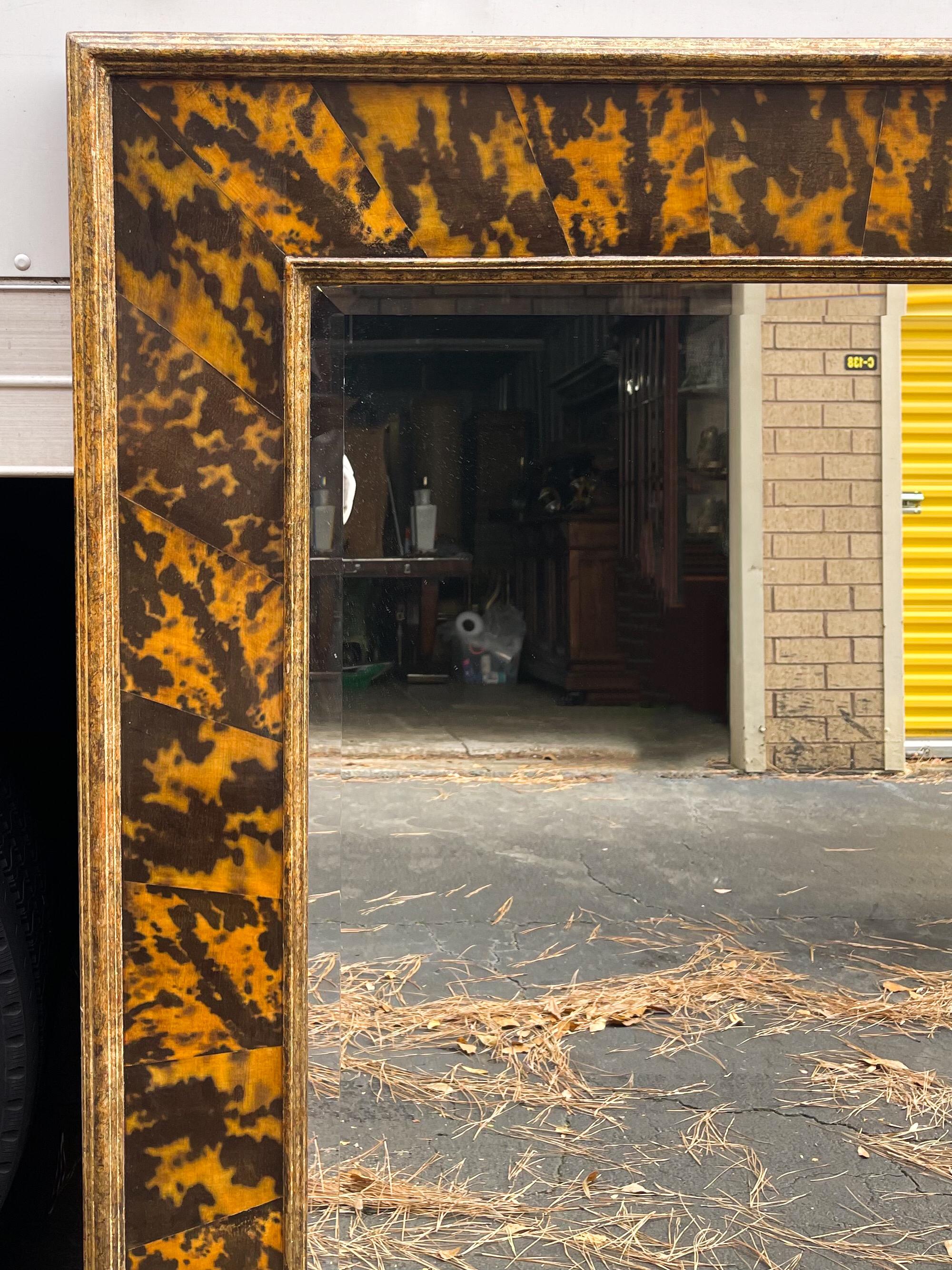 This is a personal favorite and a rare bird! This is a large scale Italian faux tortoise shell and giltwood mirror. It is unmarked and the very good condition.