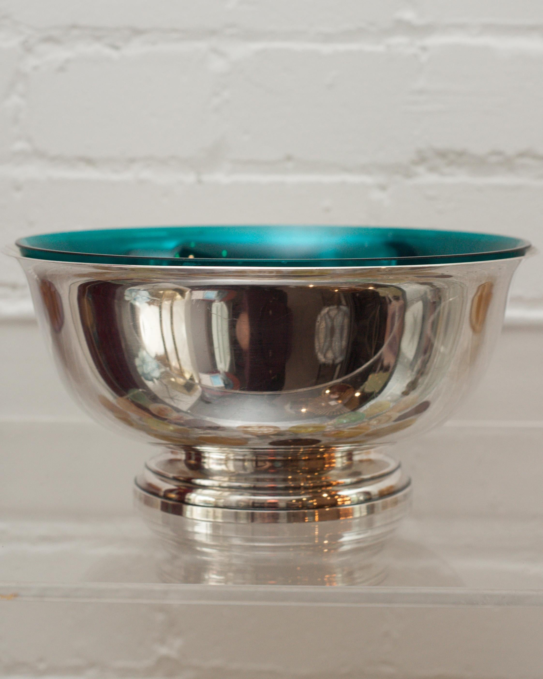 A beautiful midcentury sterling silver bowl with vivid blue glass liner. This Revere style bowl is perfect for fruits, candies, nuts. Due to the vibrant interior liner, this vessel is a beautiful empty as filled, and is easy to maintain when in use
