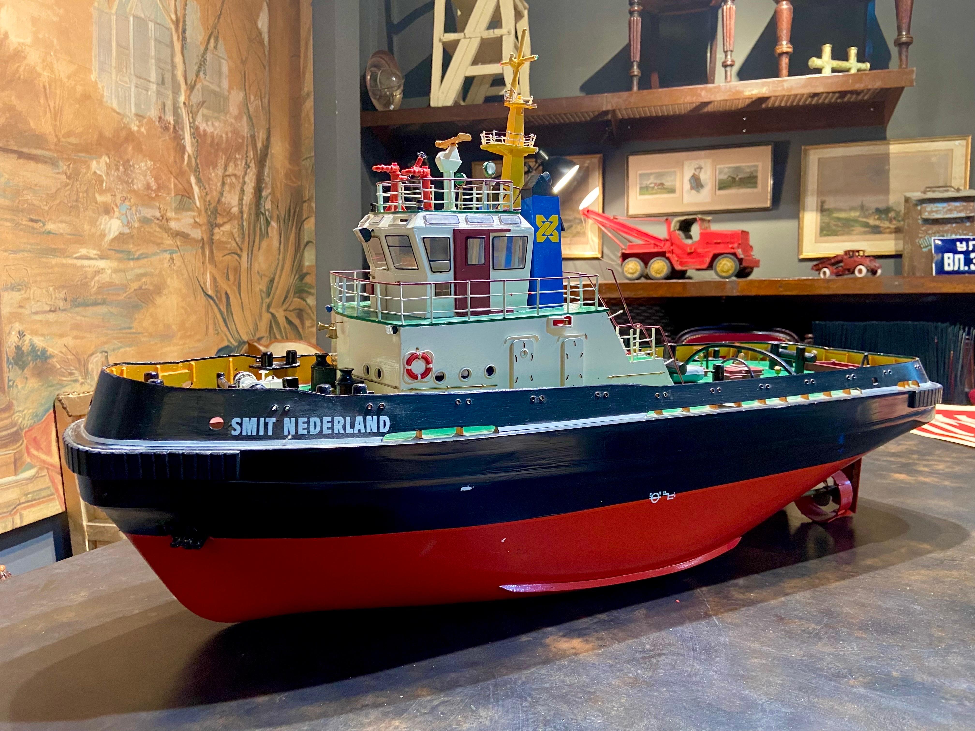 Large plastic model of tug boat Smit Nederland made circa 2005.
Small fading and some little pieces missing.
     