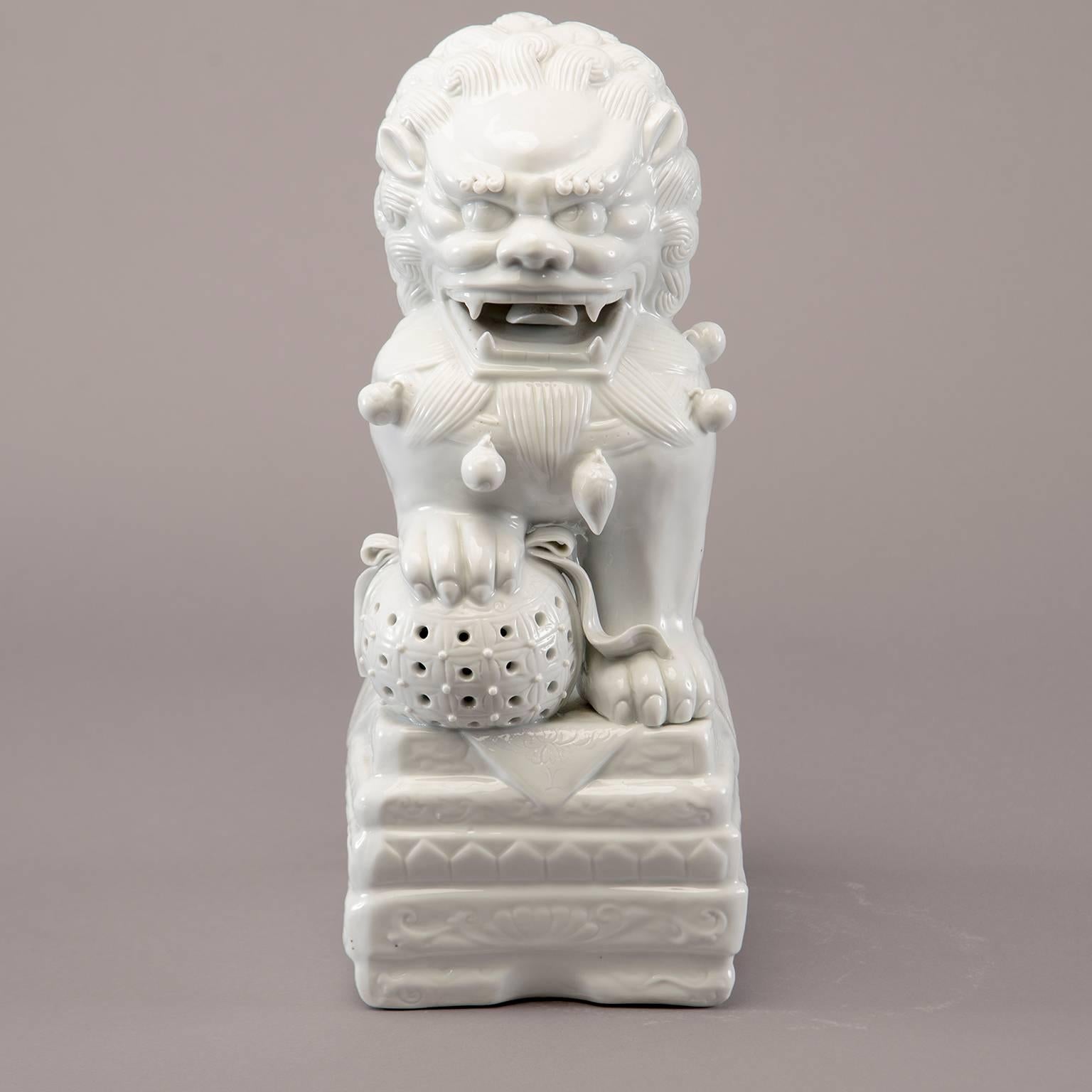 Large circa 1970s white glazed porcelain Chinese Foo dog rendered in intricate detail.  No flaws or damage found. 