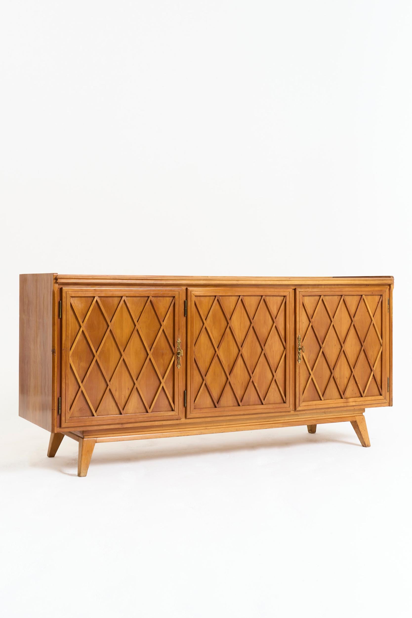 A cherrywood three-door lattice work sideboard, in the manner of Gio Ponti
Italy, mid 20th Century

