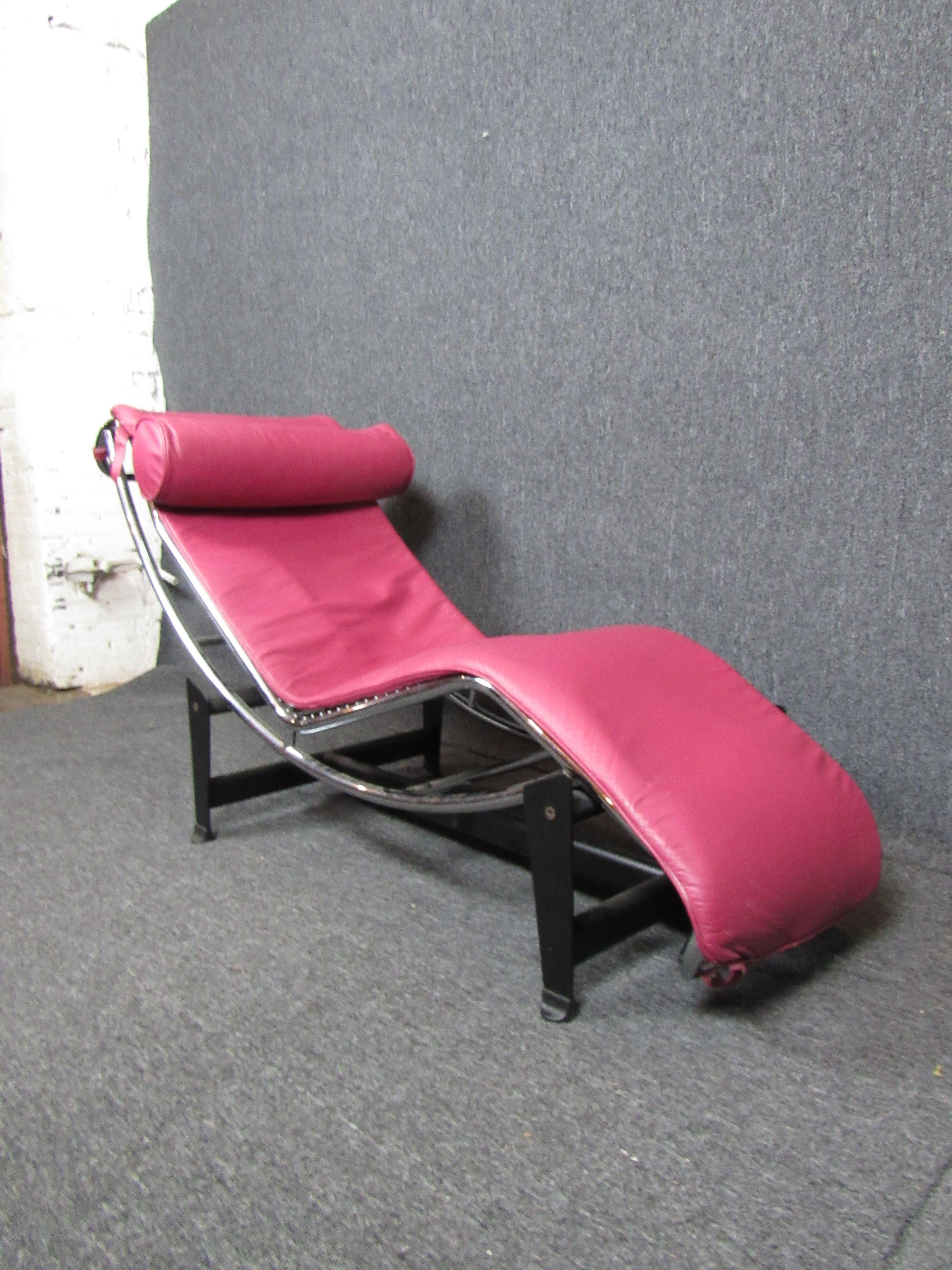 Terrifically funky mid-century chaise lounge. A colorful pink leather cushion with an attached pillow sits atop heavy duty webbing and chrome tubing for a comfortable and supportive lounge. Adjustable base allows you to fully recline. 

Please