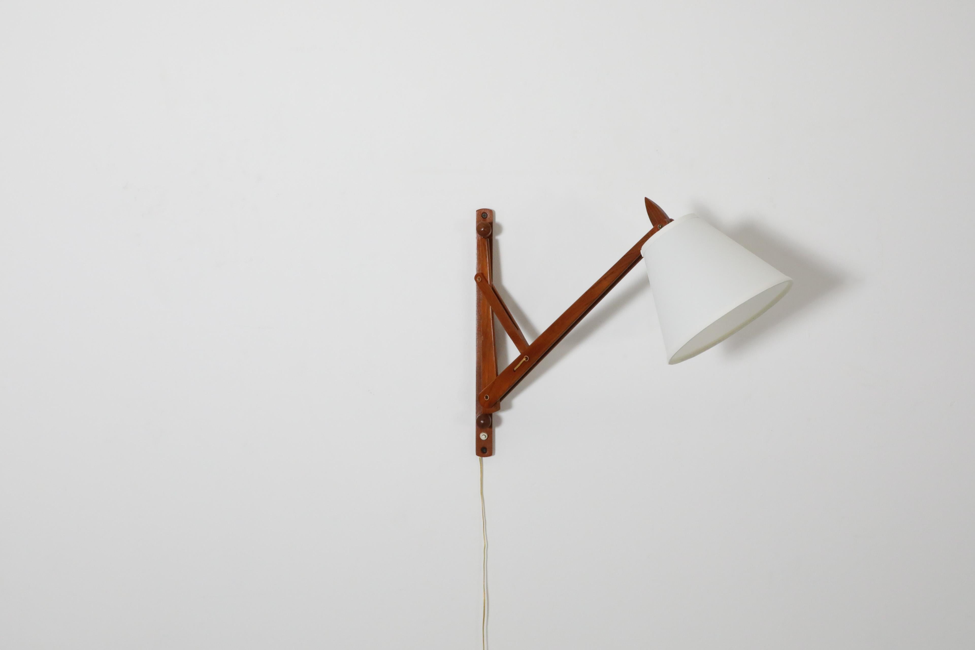 Mid-Century Le Klint style Teak Wall Mount Adjustable Light In Good Condition For Sale In Los Angeles, CA