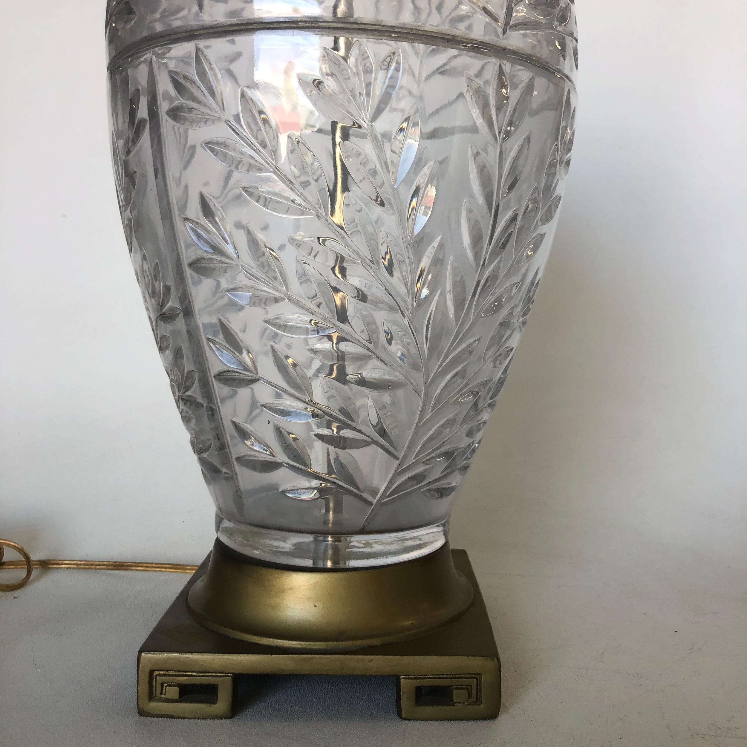 Midcentury leaf motif cut crystal table lamp with brass hardware along the top and bottom.

Measure: 21