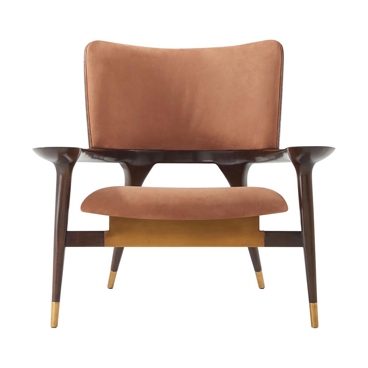 With shapely legs that taper beneath the elegant frame and a floating seat. Gracefully curving into sculptural arms, a delicate balance is formed between distinguished metal accents and exquisite veneer.

Dimensions: 37.5