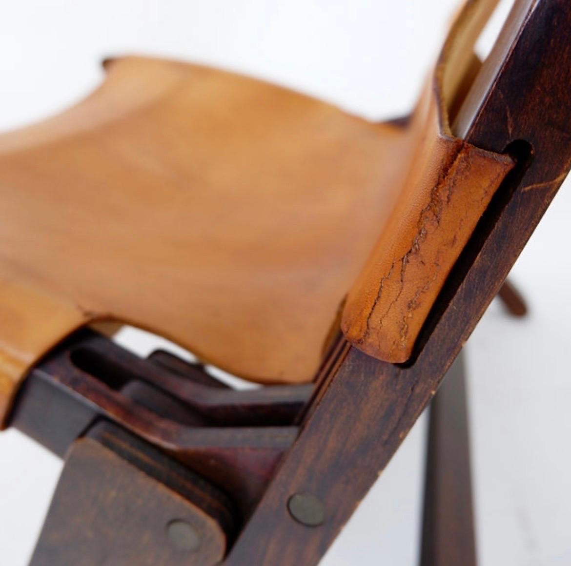 Leather Mid century leather and wood folding armchair, 1950s For Sale
