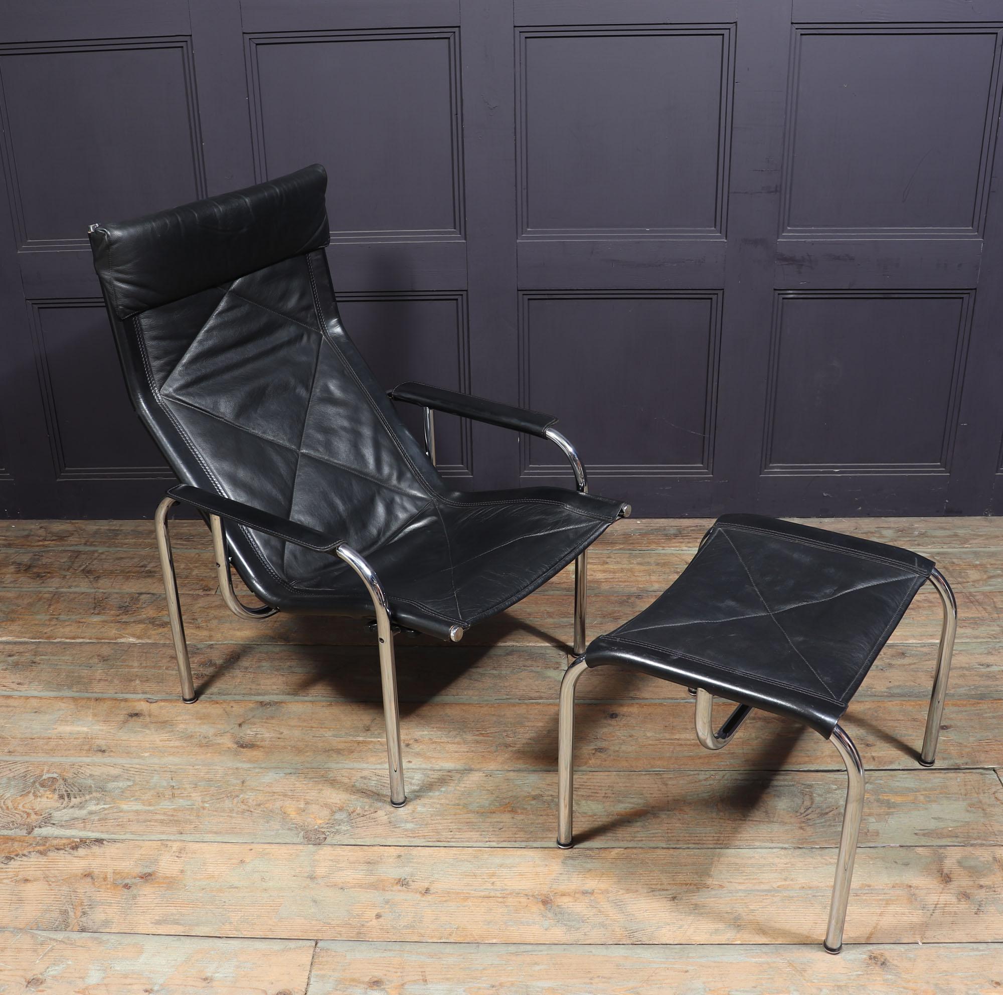 Swiss Mid Century Leather Armchair and stool by Hans Eichenberger For Sale