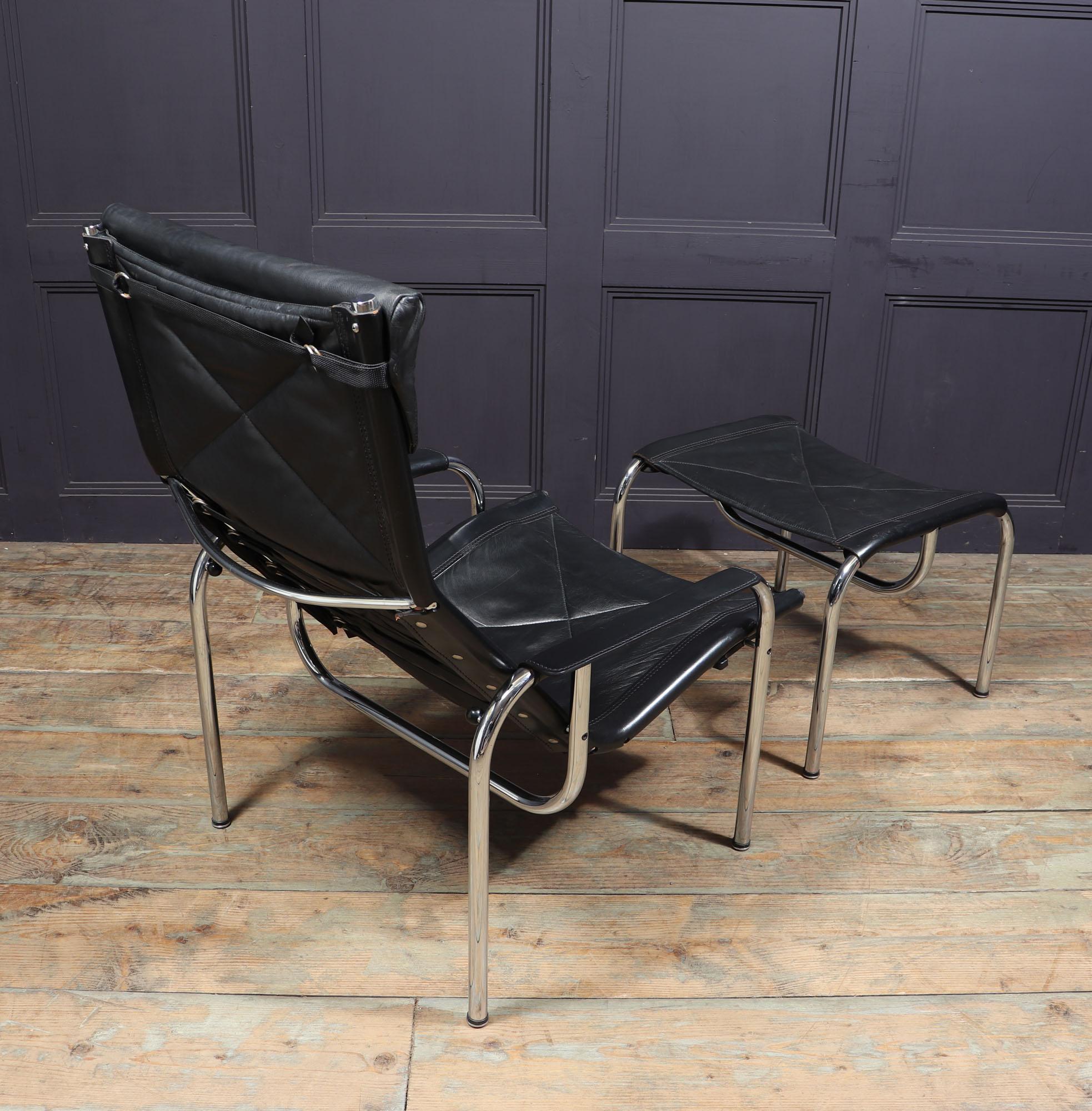 Late 20th Century Mid Century Leather Armchair and stool by Hans Eichenberger For Sale