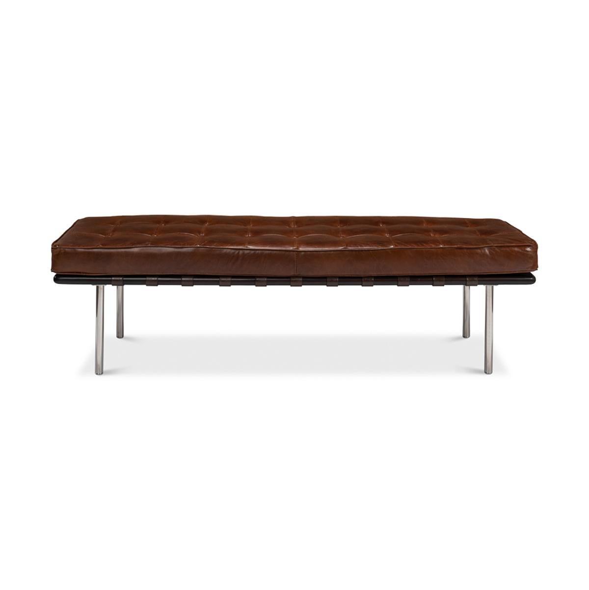 Mid century style leather bench with a top grain brown boxed and tufted leather cushion seat on a simple stainless steel four-leg base.

Dimensions: 64