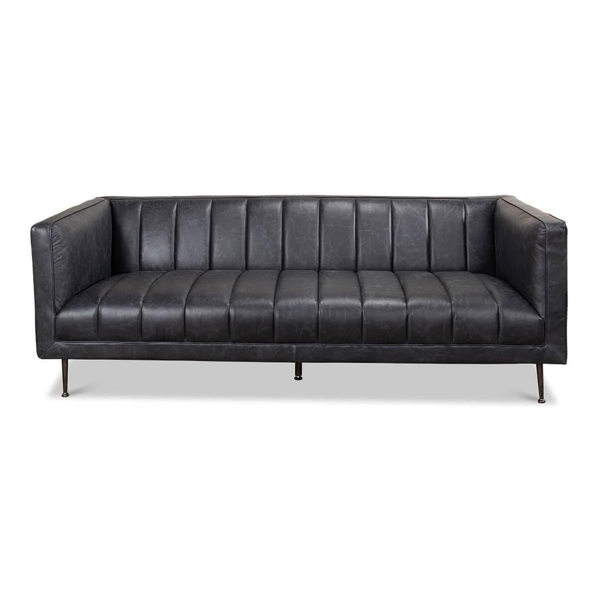 Mid-Century Modern style leather upholstered and channeled sofa. The channel tufted top grain leather sofa in a Nottinghill grey color and raised on steel tapered legs.

Dimensions: 83