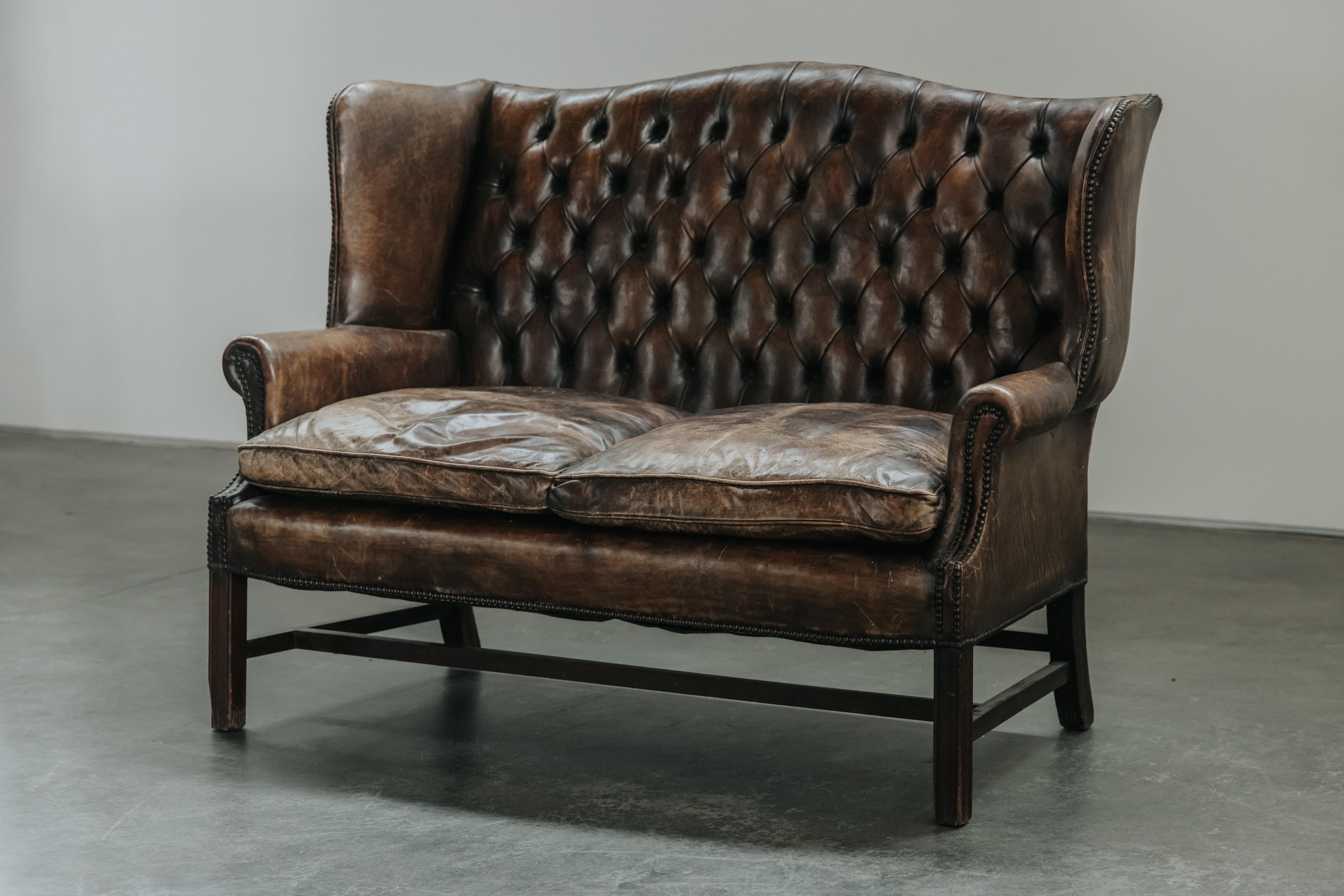 Mid Century Leather Chesterfield Sofa From France, Circa 1950.  Original brown leather upholstery with great patina and use.