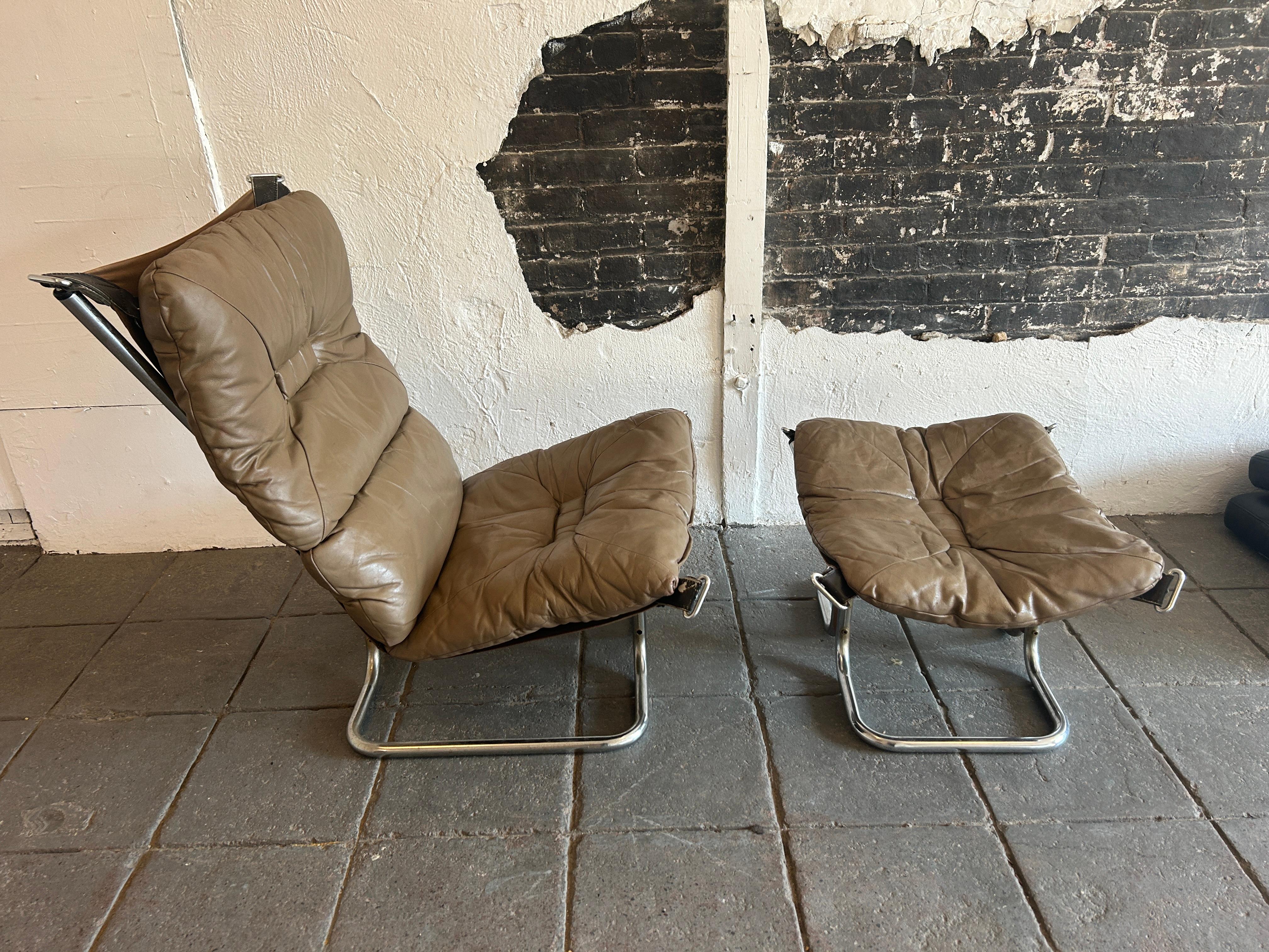 Midcentury Leather chrome round tube lounge chair and ottoman by Sigurd Ressell. Falcon Chair and ottoman. Leather is distressed and broken in - Shows signs of wear. All straps are in good shape and canvas is tight. Canvas is good on chair and the