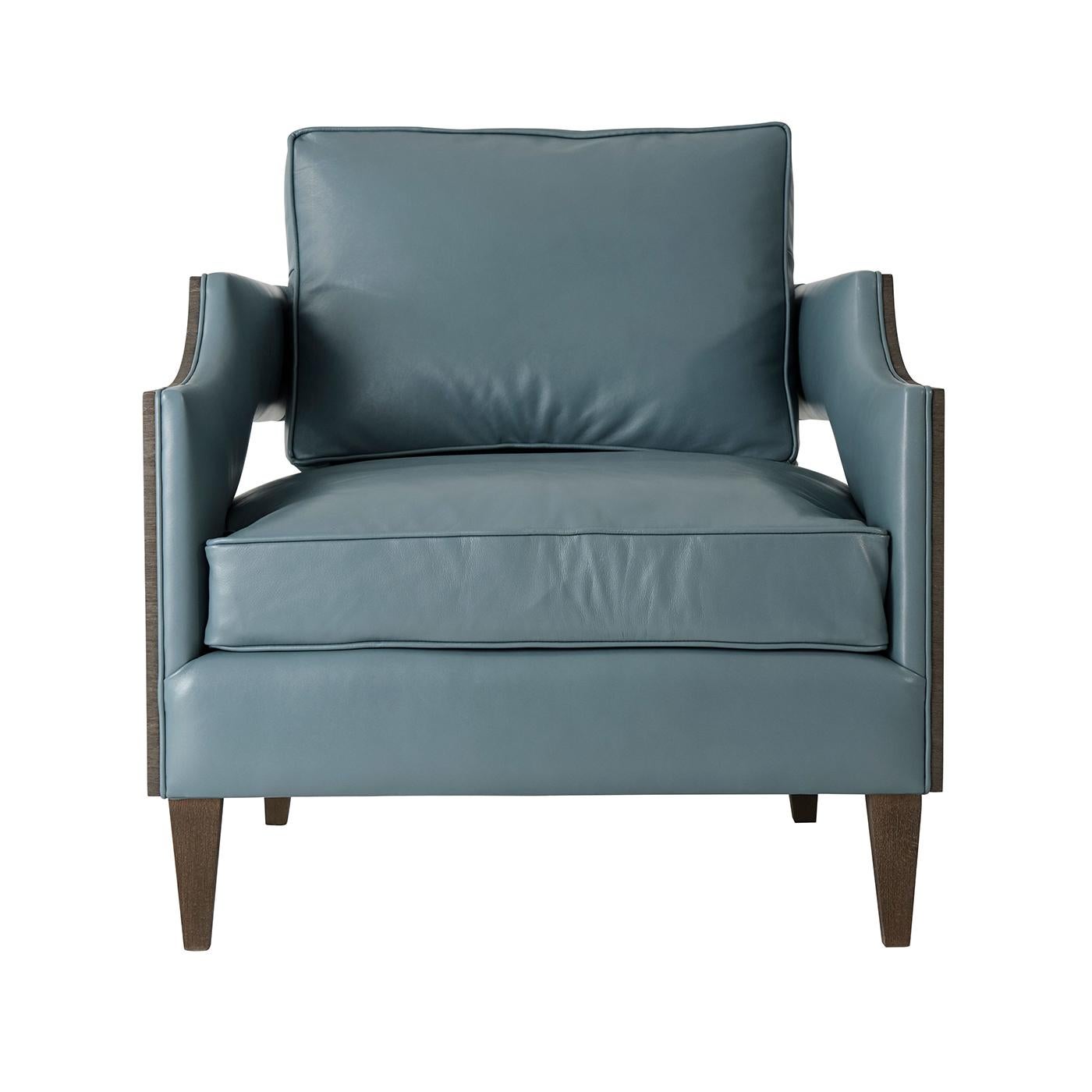 A modern style leather upholstered club chair with loose cushion back and seat with our textured veneer outside frame and square tapered legs.

Dimensions: 31