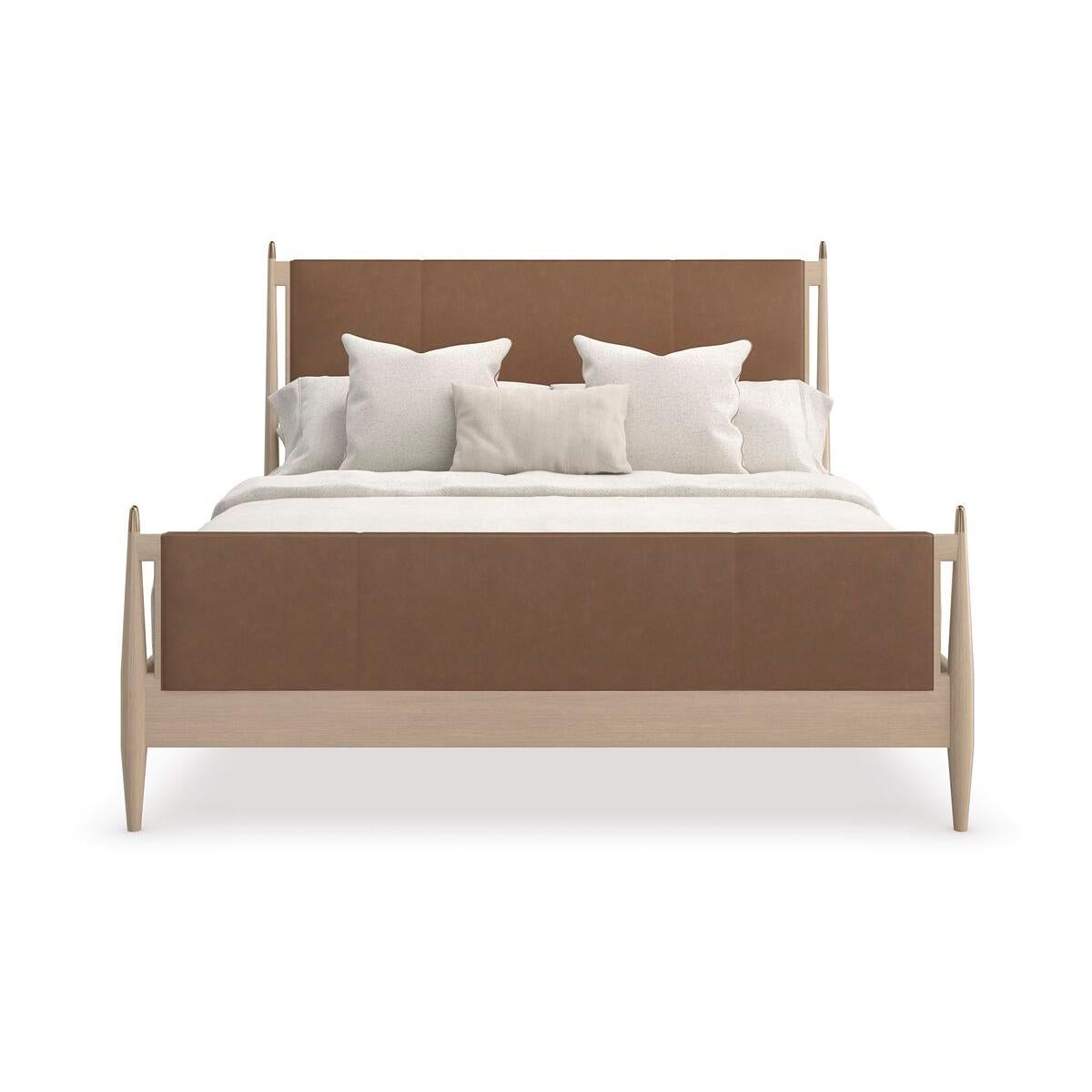 With flowing modern lines and a rich use of material, the bed brings a simple yet sophisticated cadence to bedroom interiors. Tailored in a lavish, camel-colored leather, its clean, parsons-style headboard warmly complements a Sun Drenched Oak wood