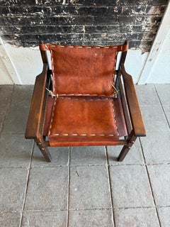 Mid century leather Safari sling lounge chair with patina