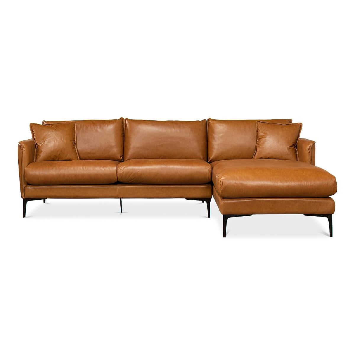 An Italian style Mid-Century Modern leather upholstered section sofa. In a top grain tan leather with a right-facing chaise. All raised on iron flared tapered legs.

Overall dimensions: 109