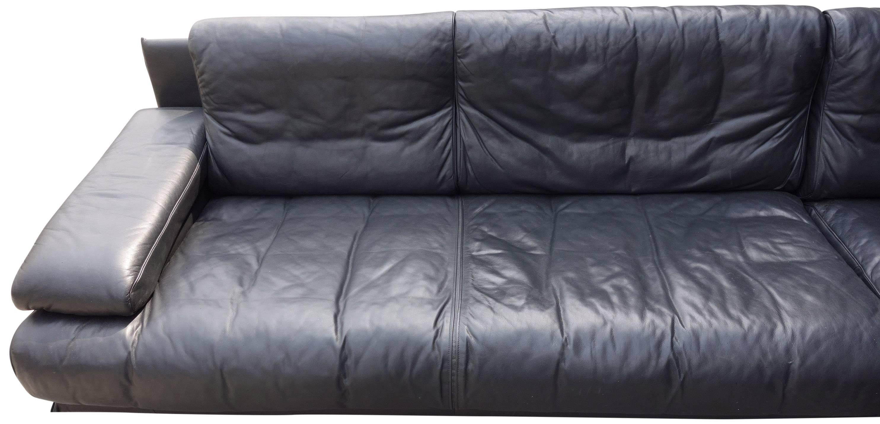 This midcentury black leather sectional on a floating chrome tubular base is a custom design produced by Cy Mann in New York. Very thick yet supple black leather. Subtle patterns from the seams resonate De Sede. Included are tubular shaped leather